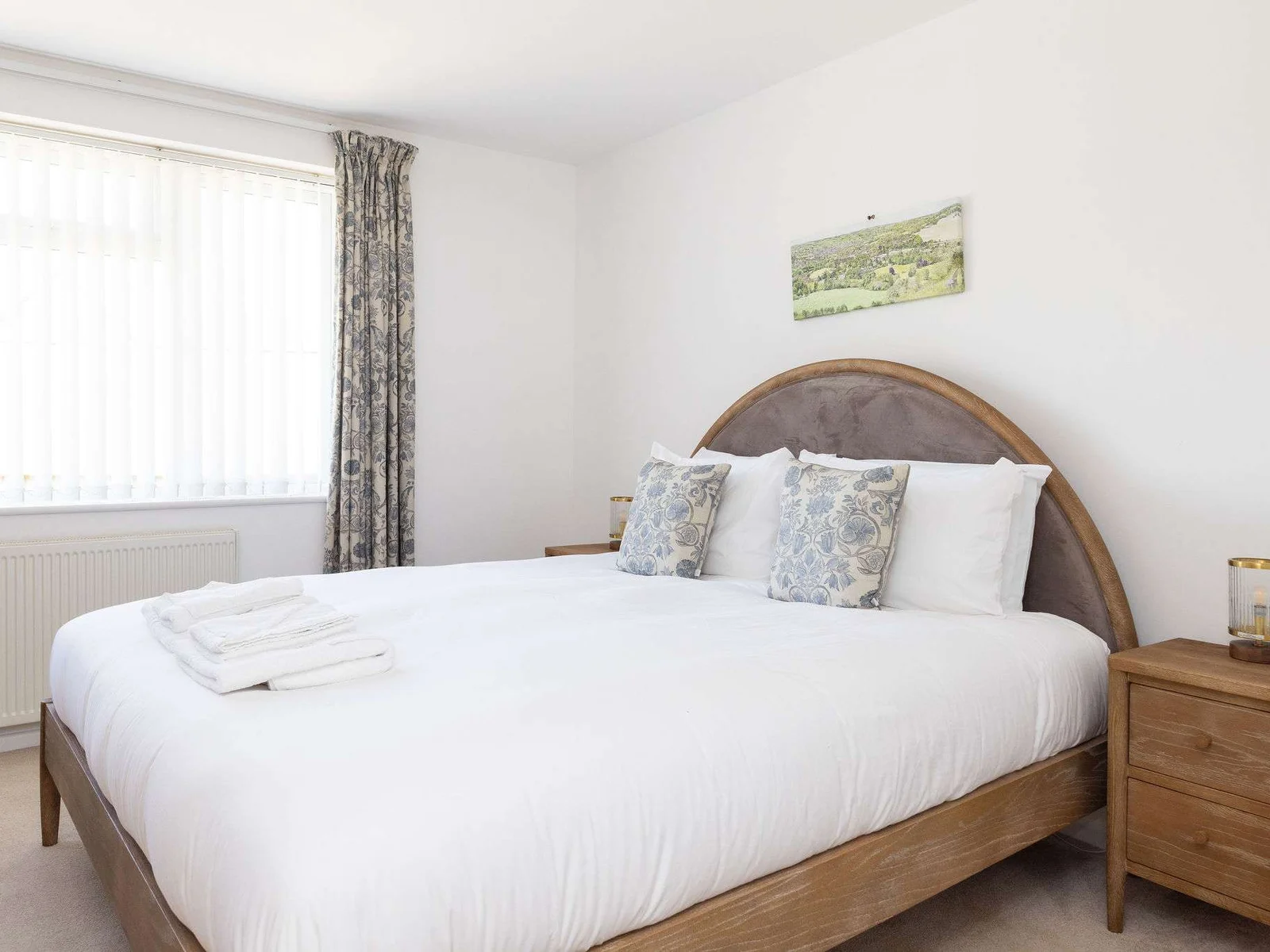 Tranquil master bedroom with super king bed and soft natural light