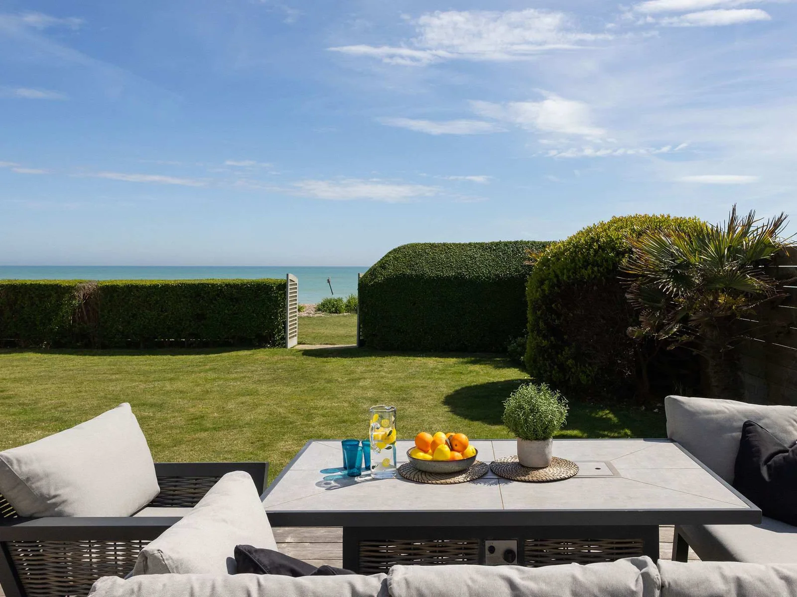 Outdoor lounge area with gas BBQ.