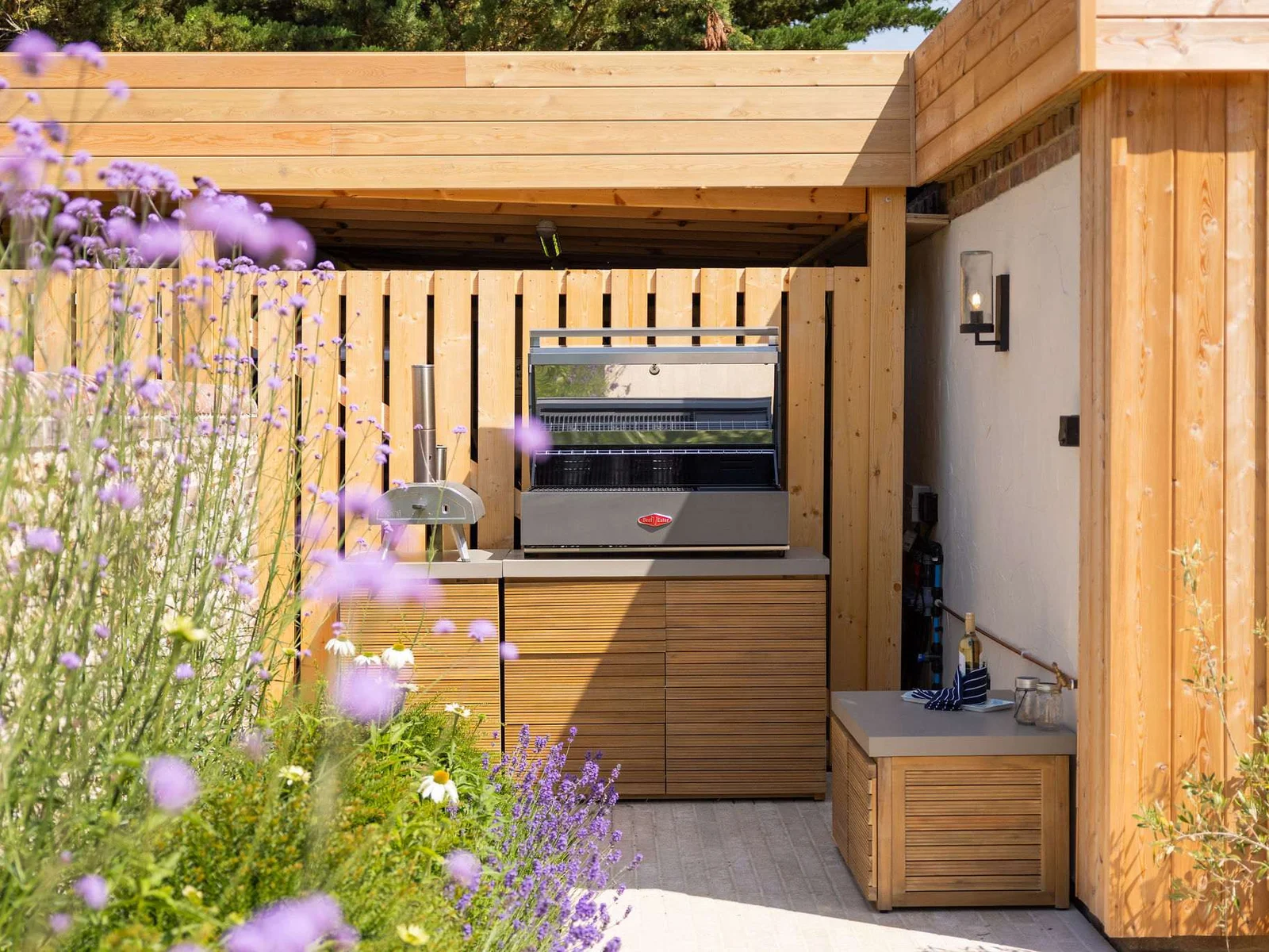 Stylish outdoor kitchen with built-in barbecue, perfect for effortless al fresco entertaining