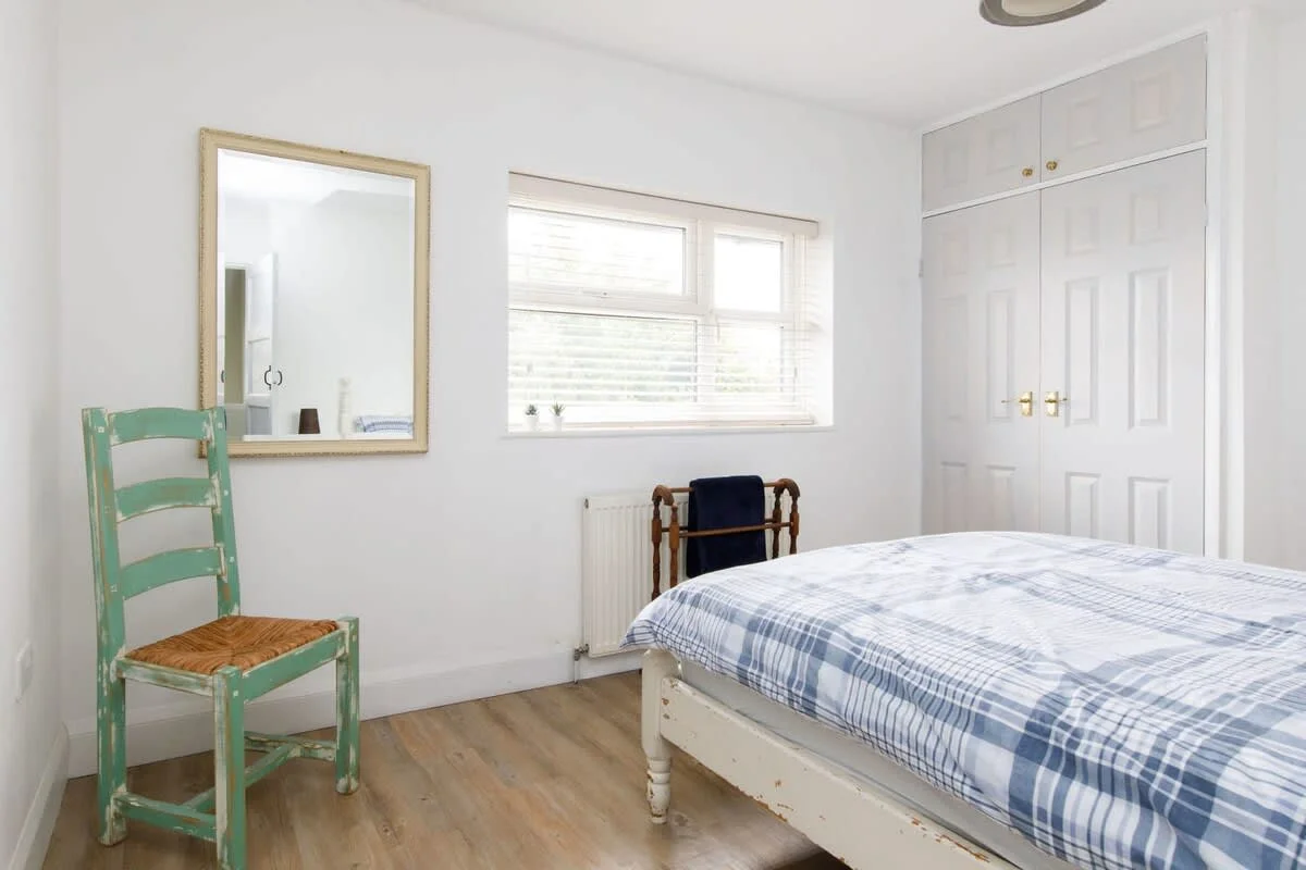 The master bedroom has a comfy king size bed and plenty of storage space for your belongings.