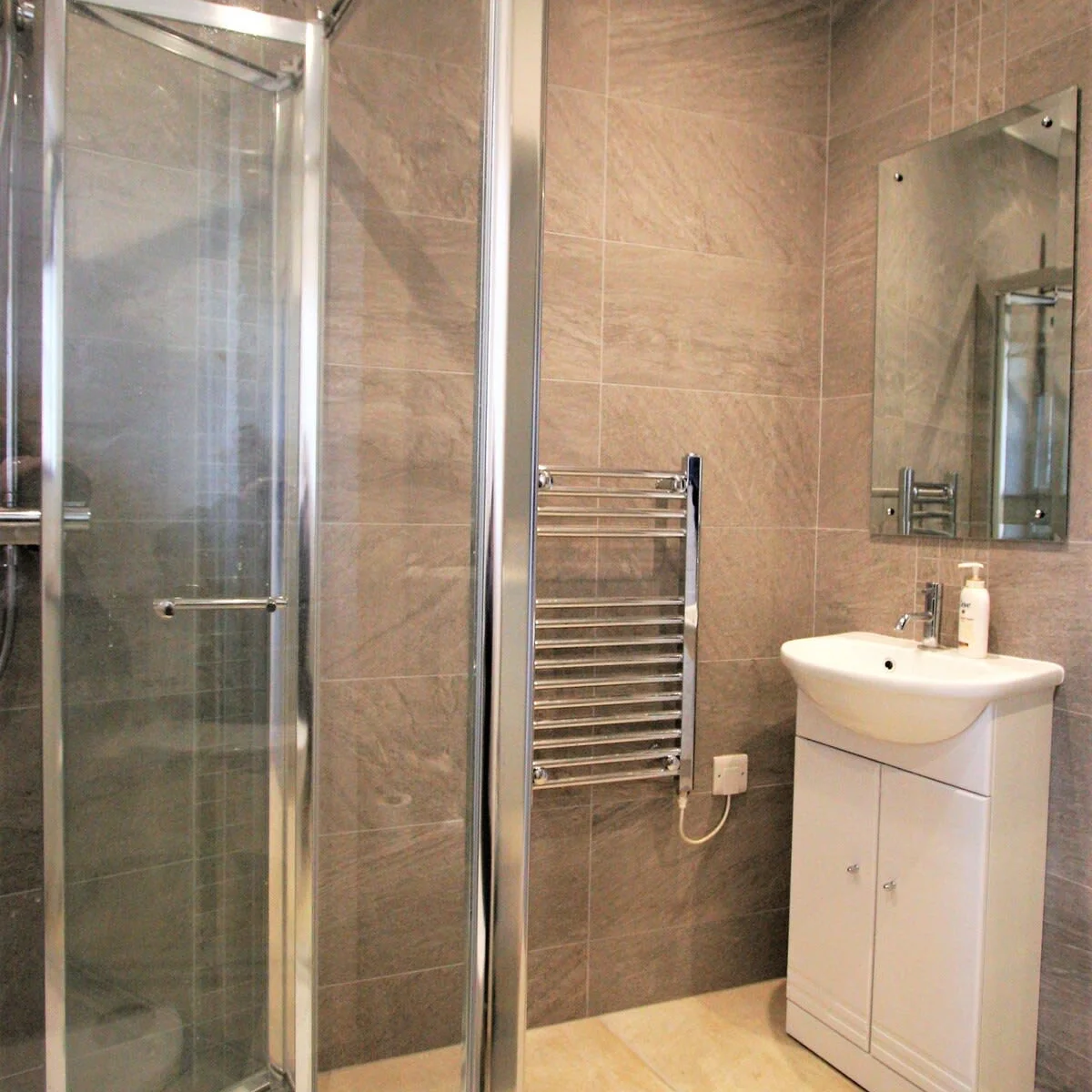 Recently refurbished walk in shower with basin, toilet and heated towel rail