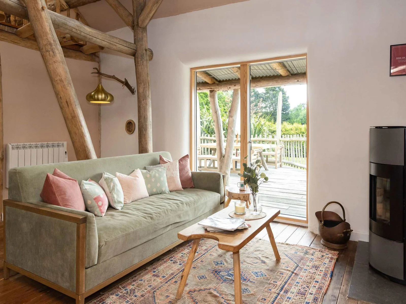 Sink into cosy comfort with soft sofas, natural light and countryside views beyond.