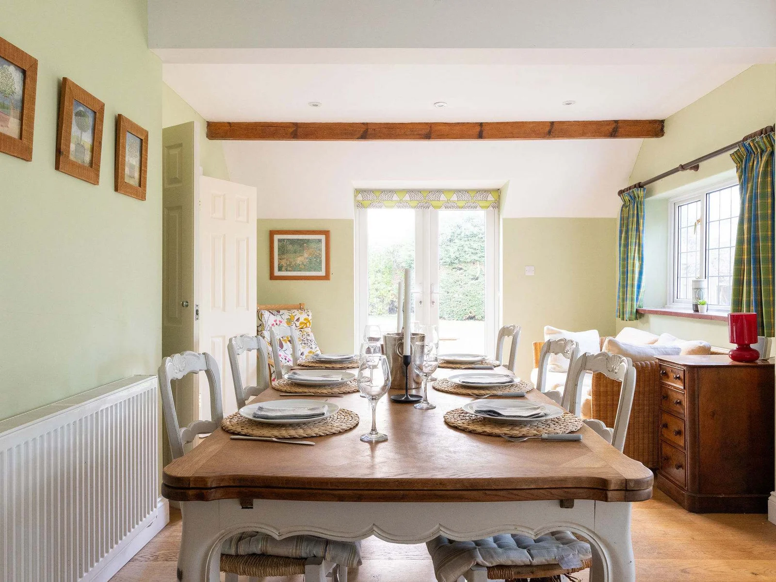 Dining area in the kitchen with double doors onto the patio