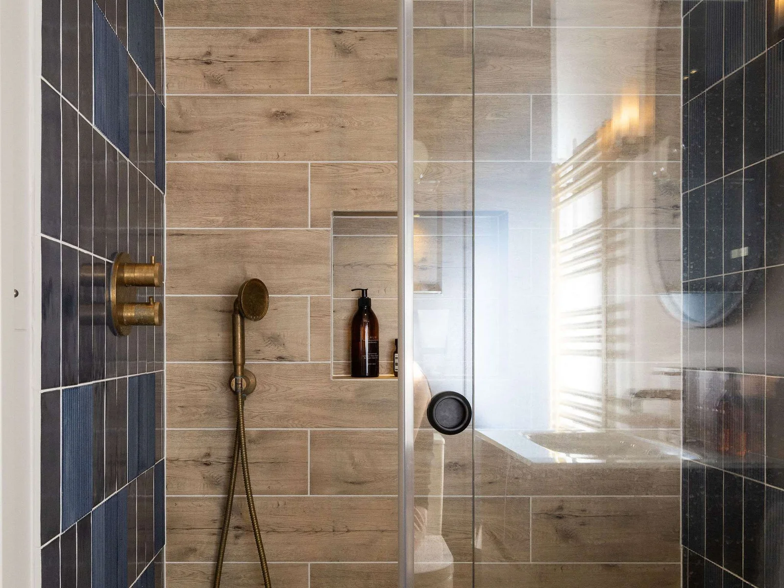 Stylish walk-in shower with wood-effect tiles