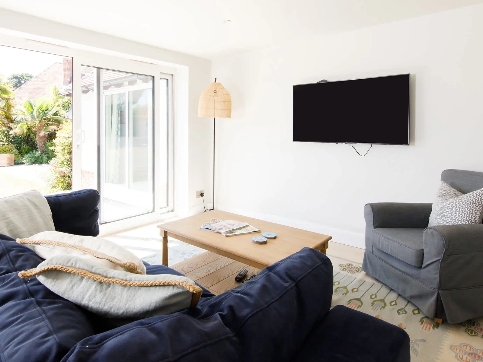 The snug lounge that connects to the kitchen is the perfect place to take the weight off with a cup of tea and a good book.