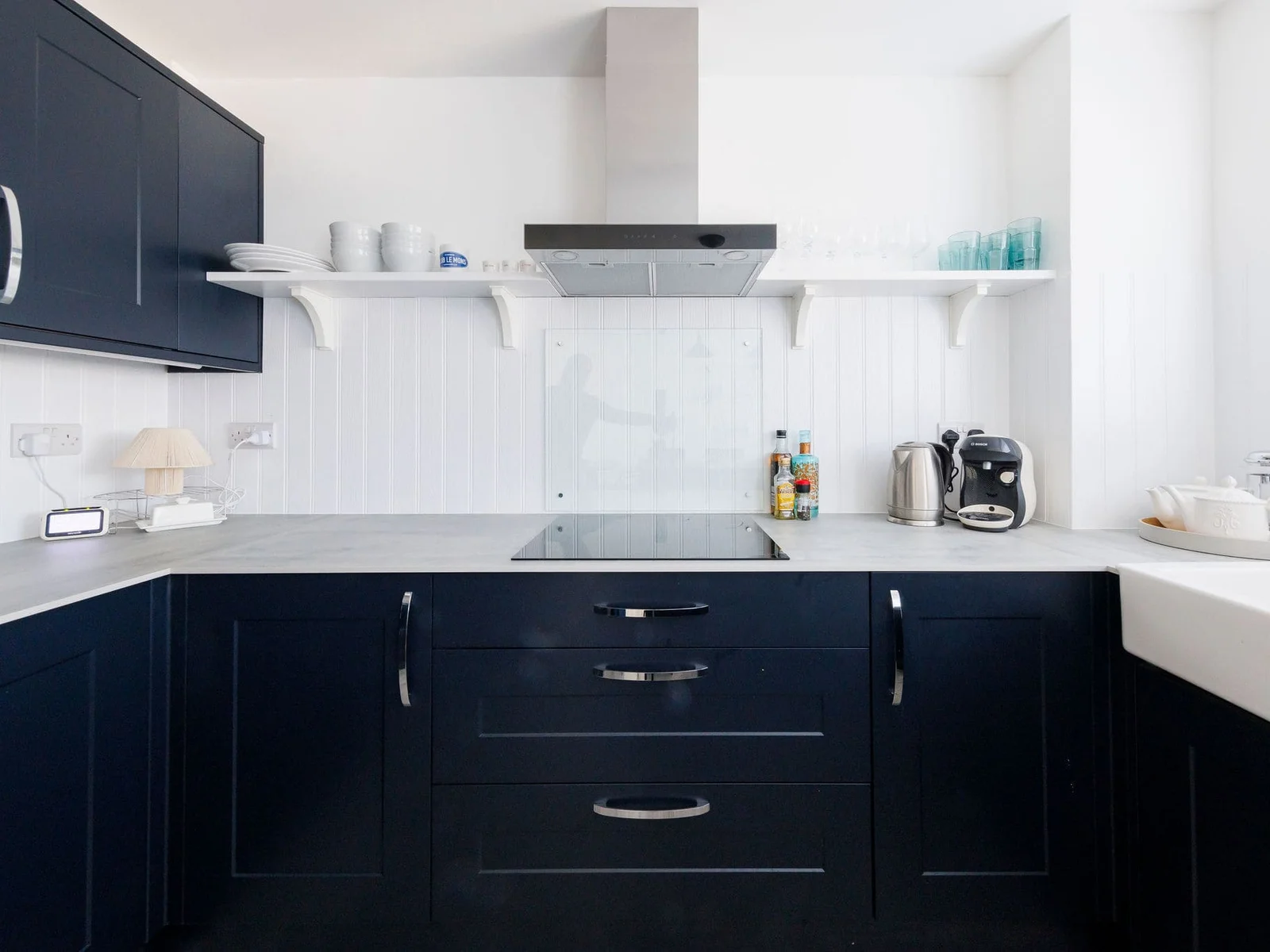 Fully equipped kitchen with induction cooktop and essentials