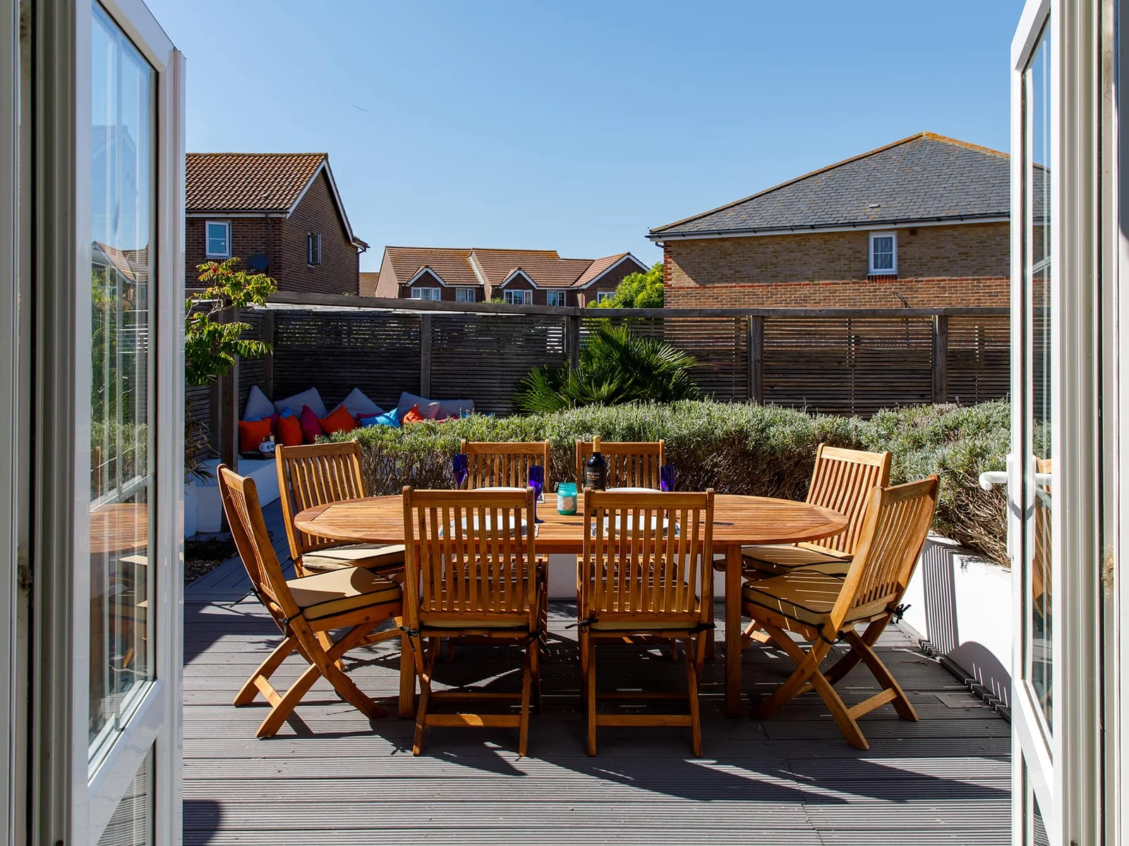 On from the kitchen, is the wonderful garden, with dining furniture, decking and BBQ.