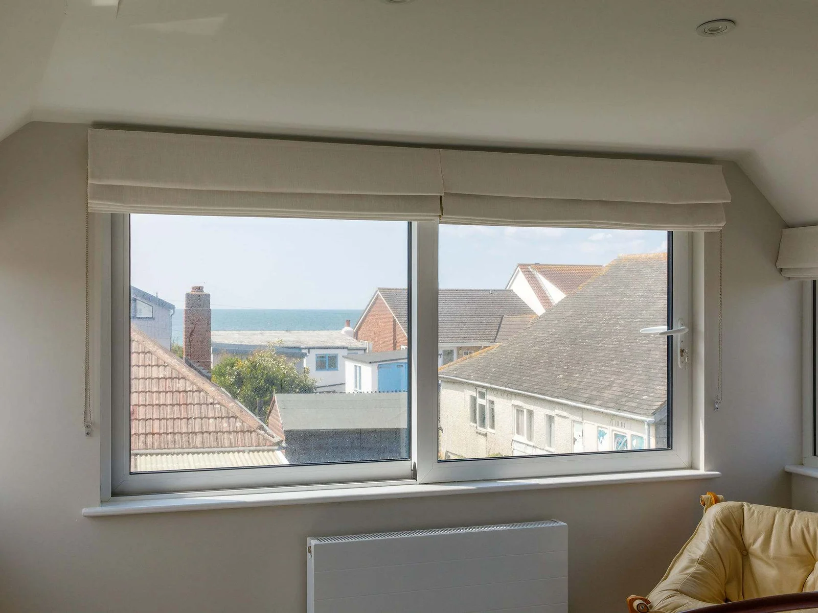 The huge window to drink in the sea view