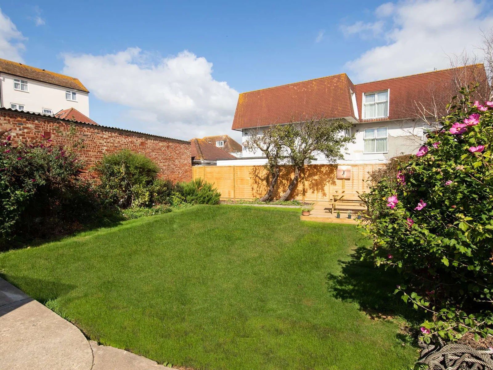 The rear garden is a shared space with the apartment above