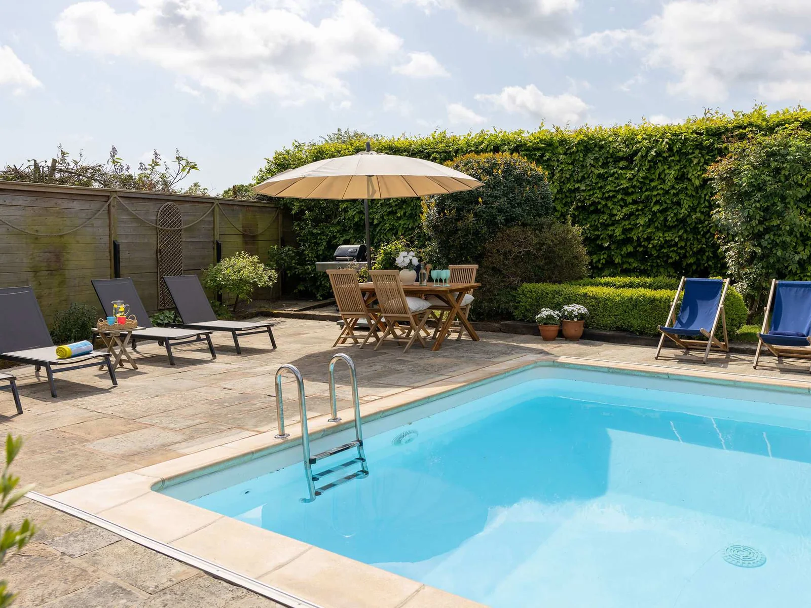 Sunny poolside area designed for laid-back outdoor living.