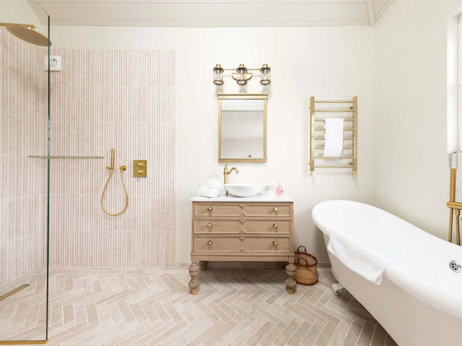 A luxurious, spa-like bathroom with a walk-in shower and deep, free standing bath.