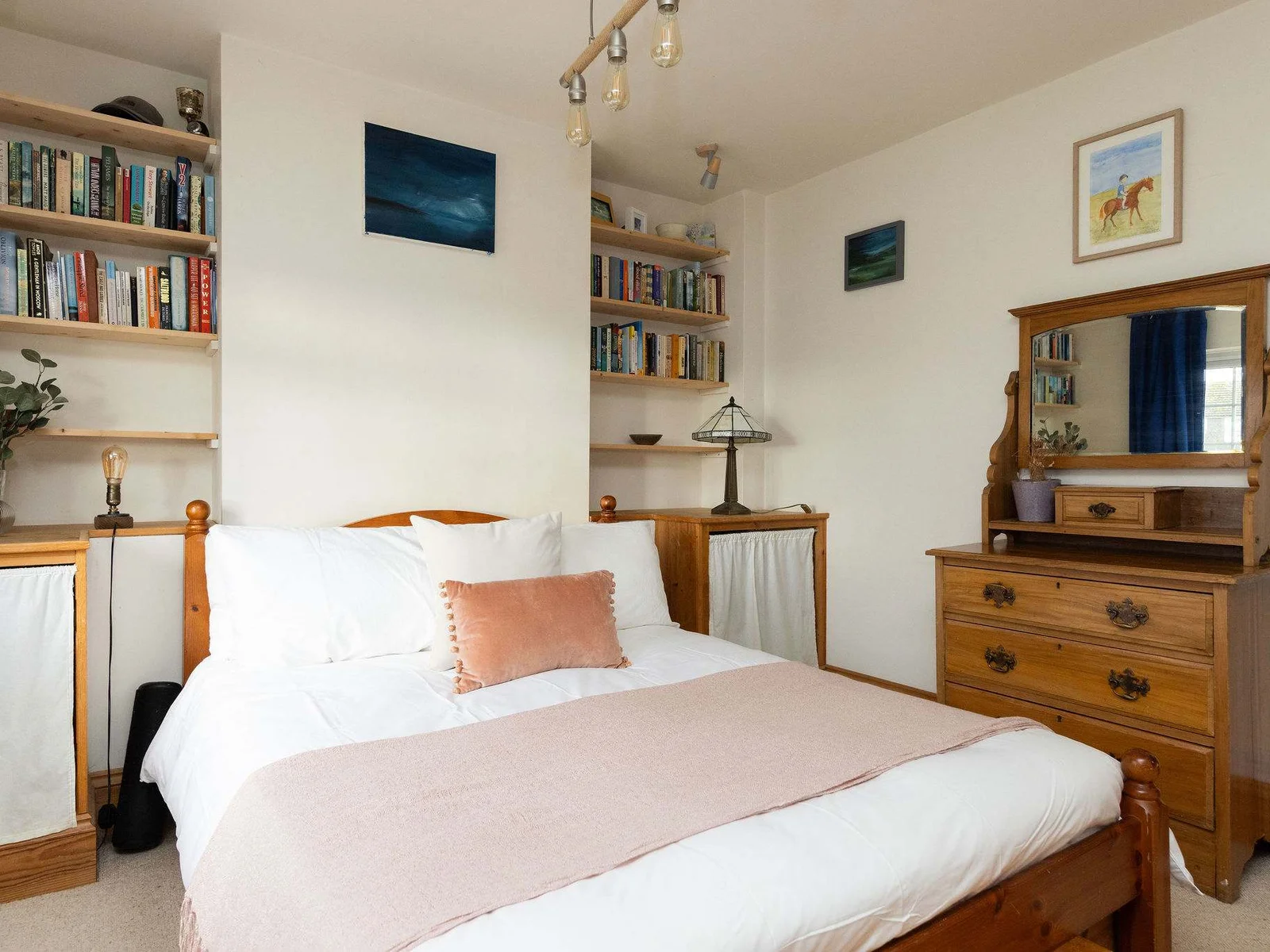 Light and comfortable master bedroom with double bed
