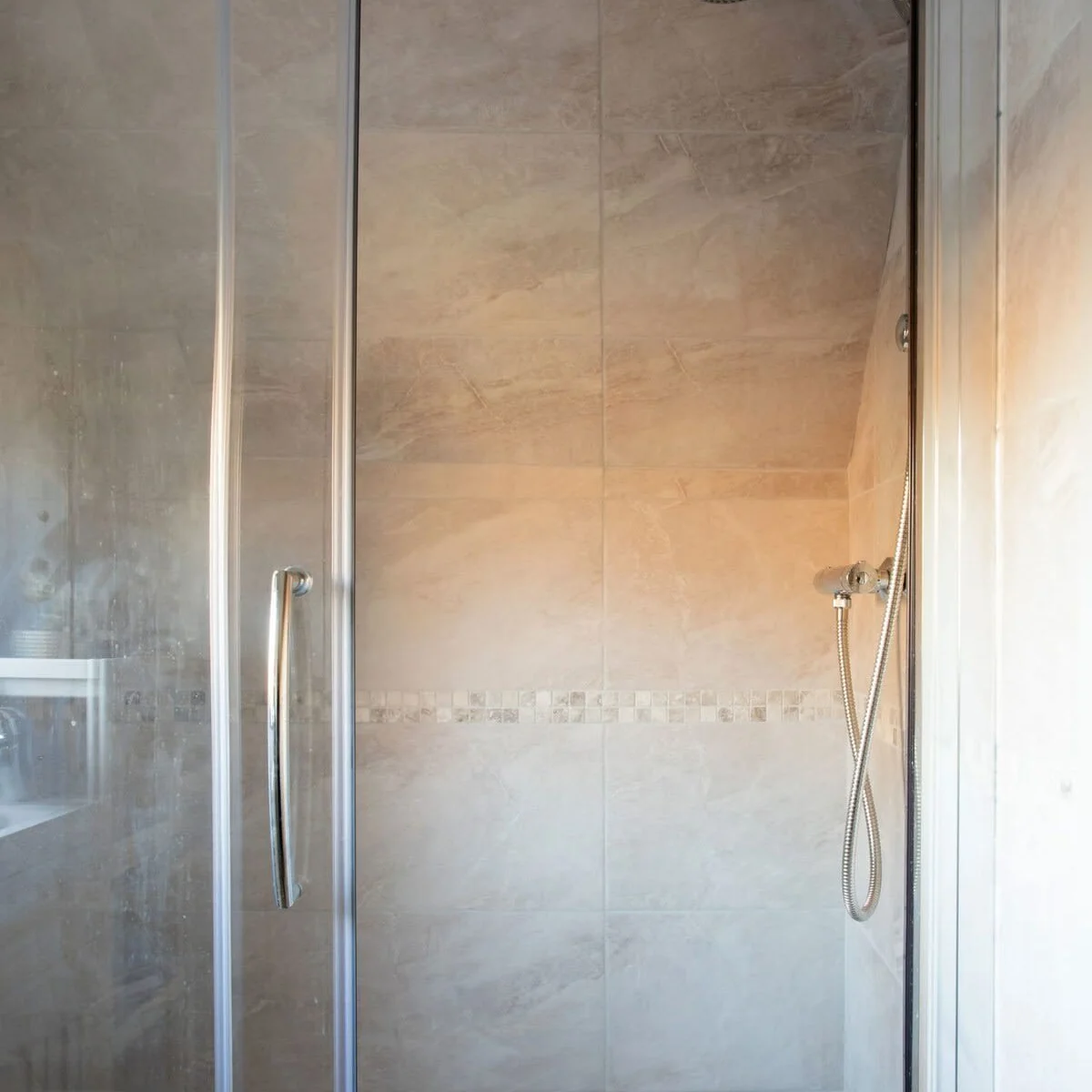 The spacious shower is perfect for freshening up after a day at the beach.