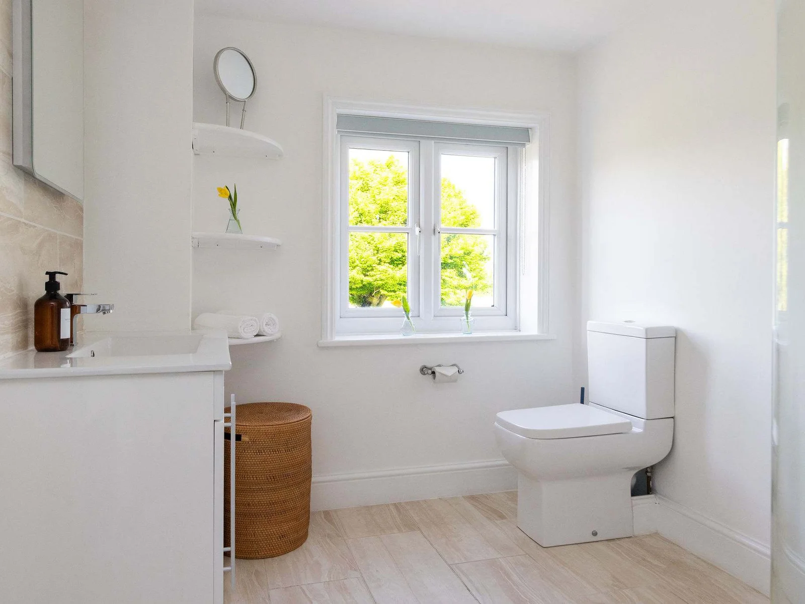 The family bathroom is spacious and light, with a WC, sink and toilet.