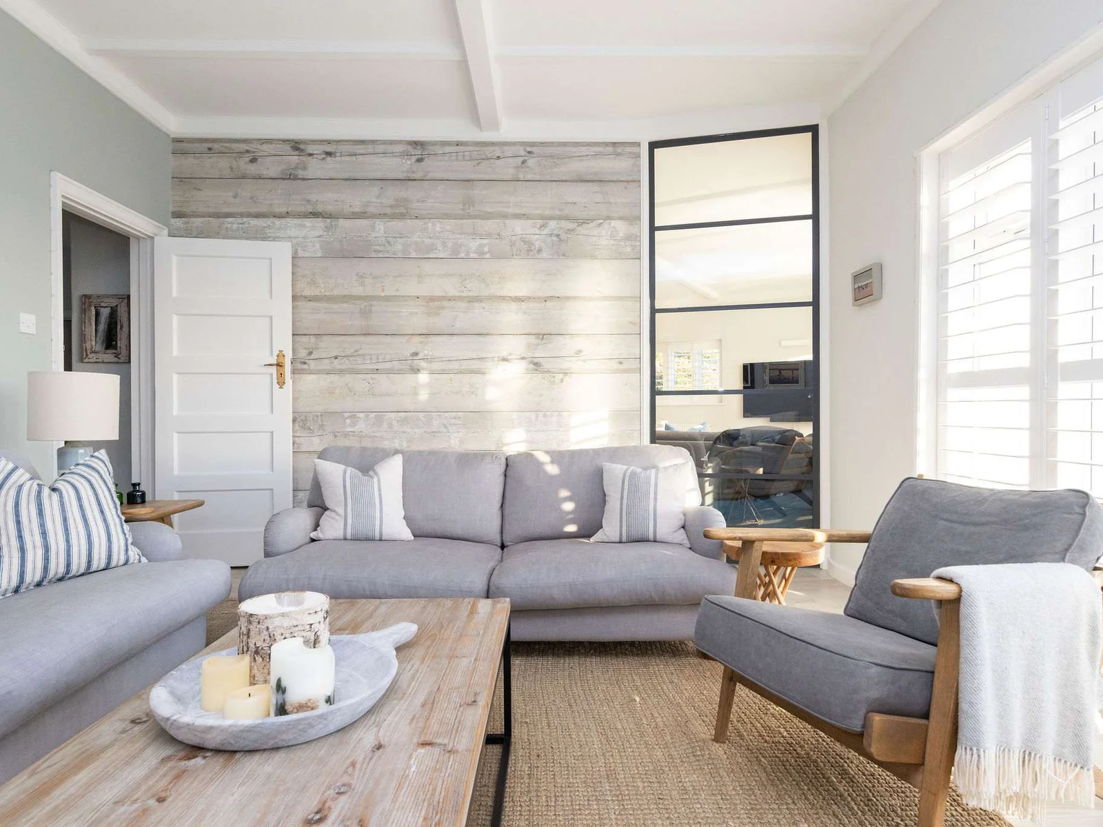 Sun-filled lounge with rustic coastal decor.