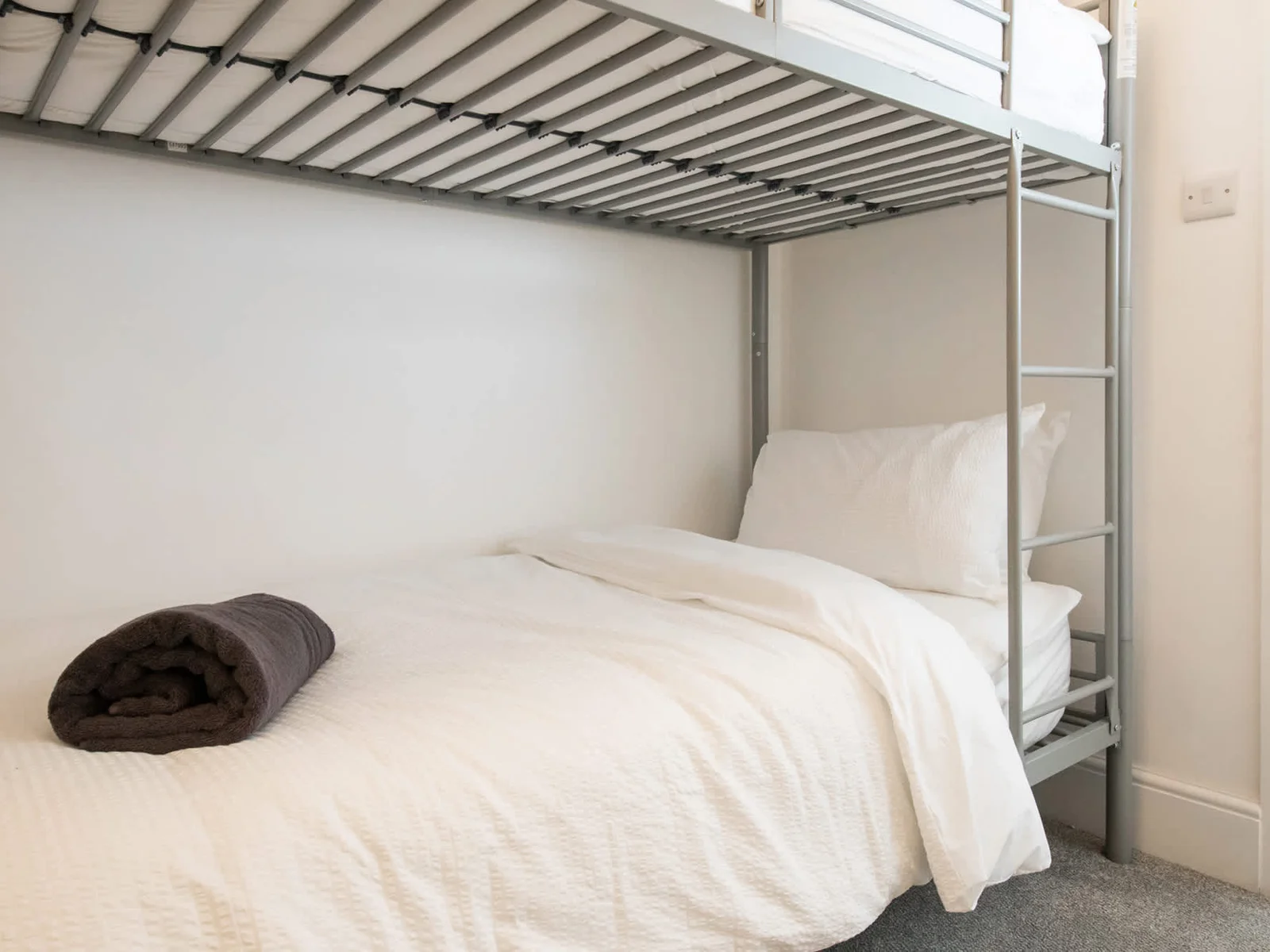 The bunk bed features two comfortable single beds