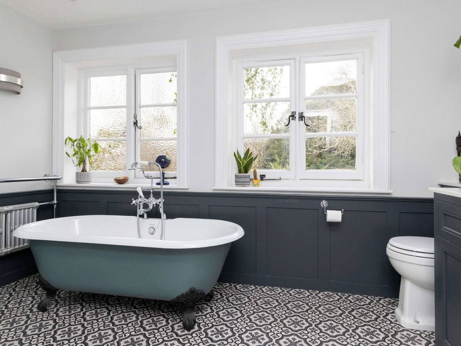 Elegant tiles and vintage fixtures add character