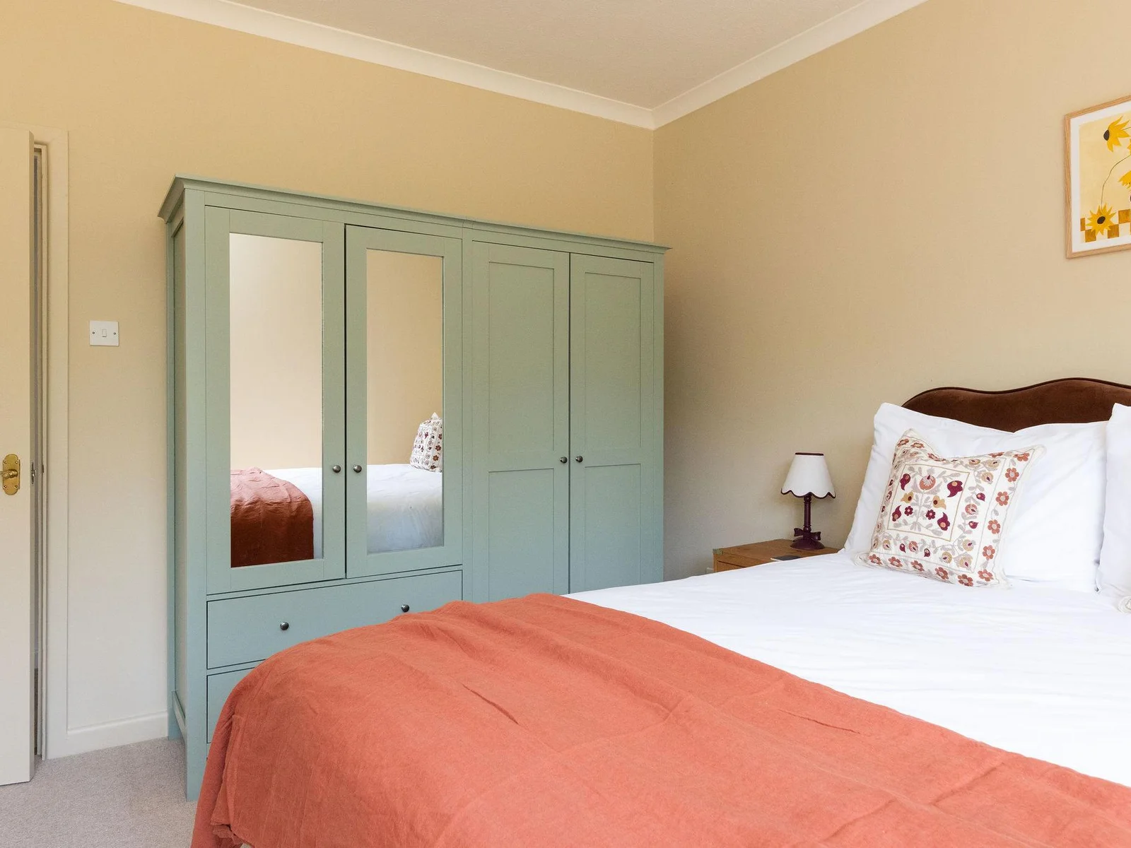 The king room has plenty of wardrobe and draw space, as well as side tables and reading lamps.
