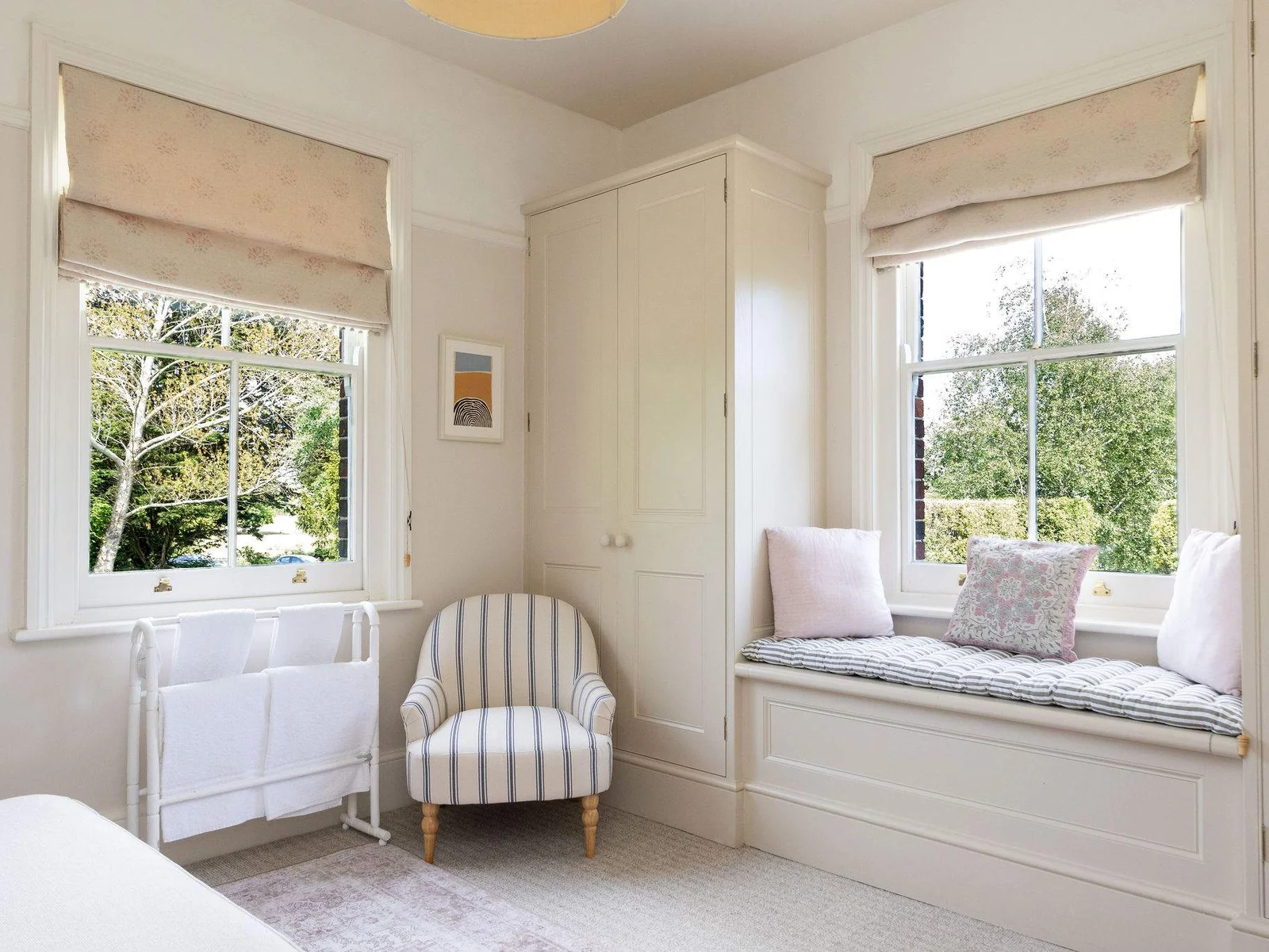 Bright bedroom corner with charming countryside touches.
