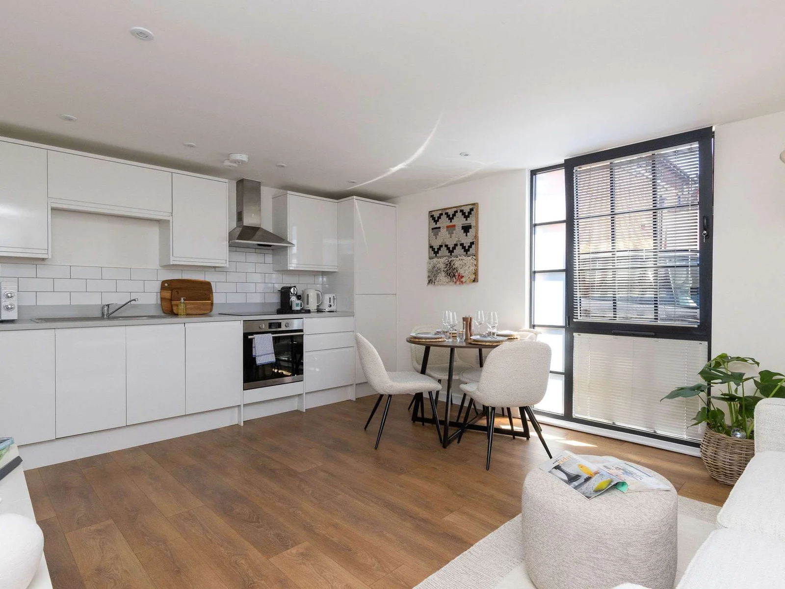 Bright open-plan living space with modern kitchen, perfect for stylish self-catering city breaks.