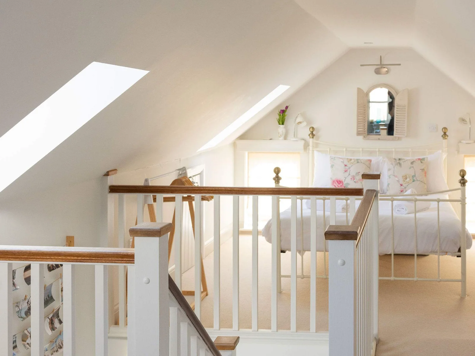 Charming loft bedroom with vaulted ceilings and soft natural light