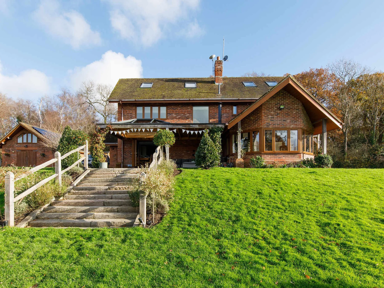 This 4000 sq ft retreat is designed to offer a unique blend of modern elegance and serene riverfront living.