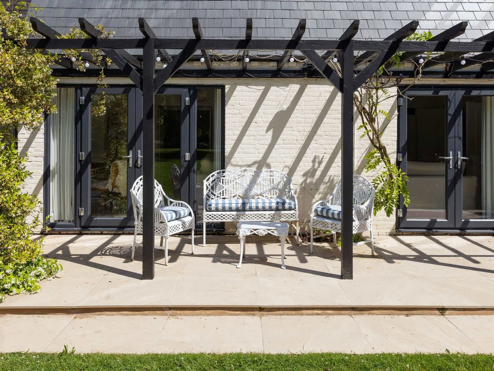 Sheltered terrace with comfortable seating, perfect for quiet mornings and leisurely afternoon breaks