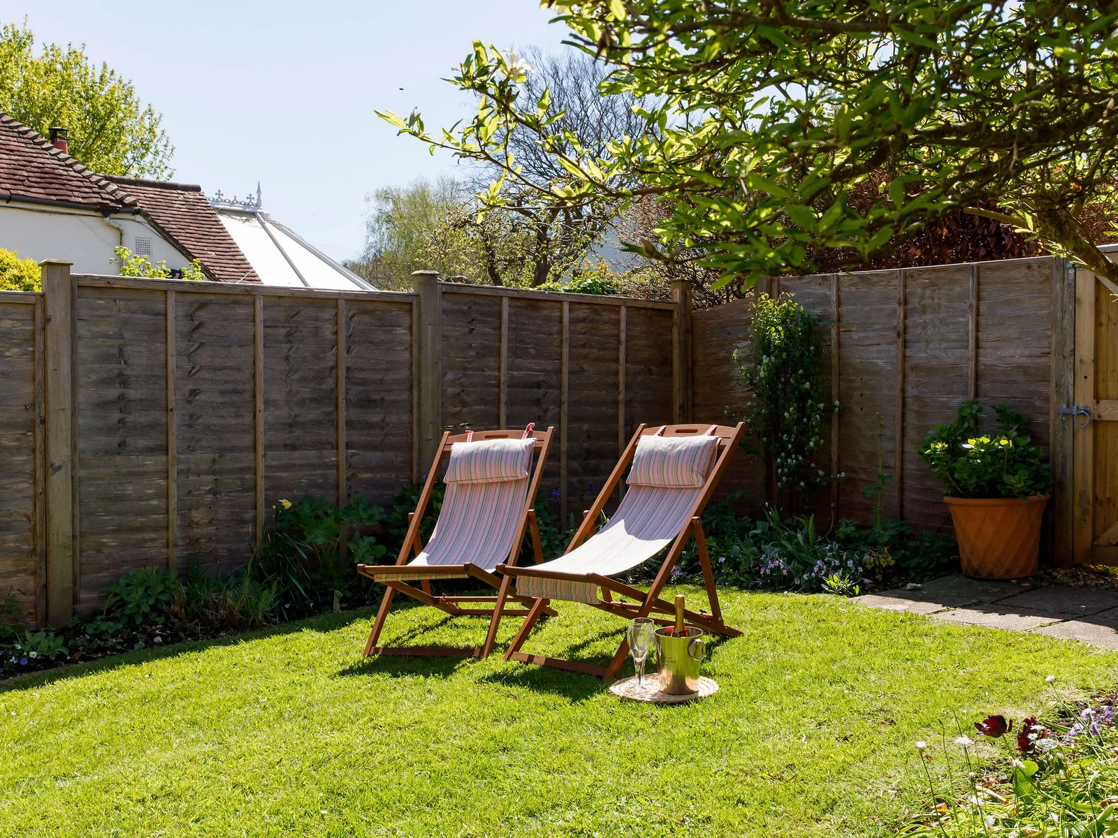Relax and soak up the sunshine in the private garden. The perfect spot for a quiet retreat, surrounded by lush greenery and the tranquil sounds of nature.