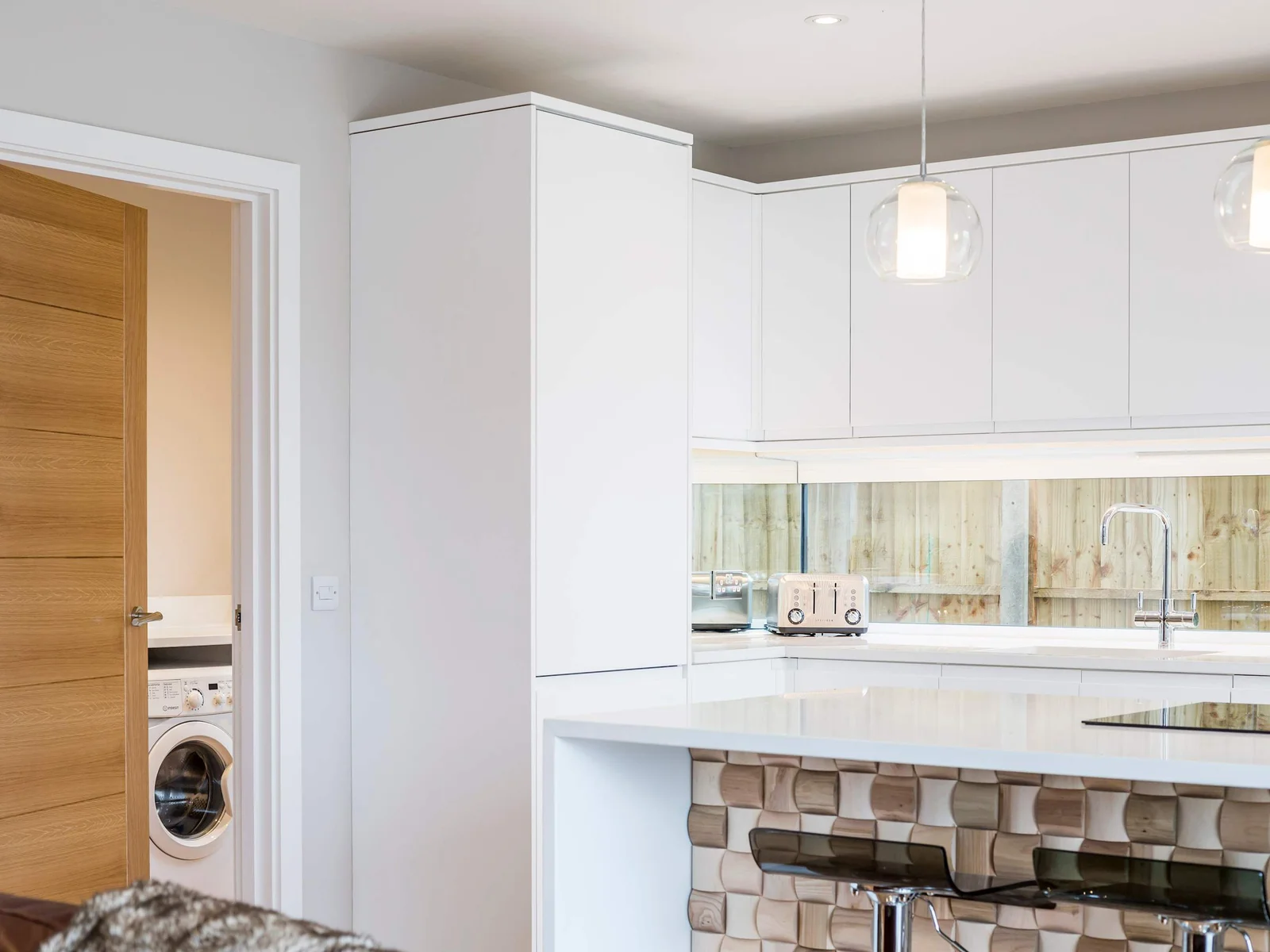 A view of the utility room from the kitchen