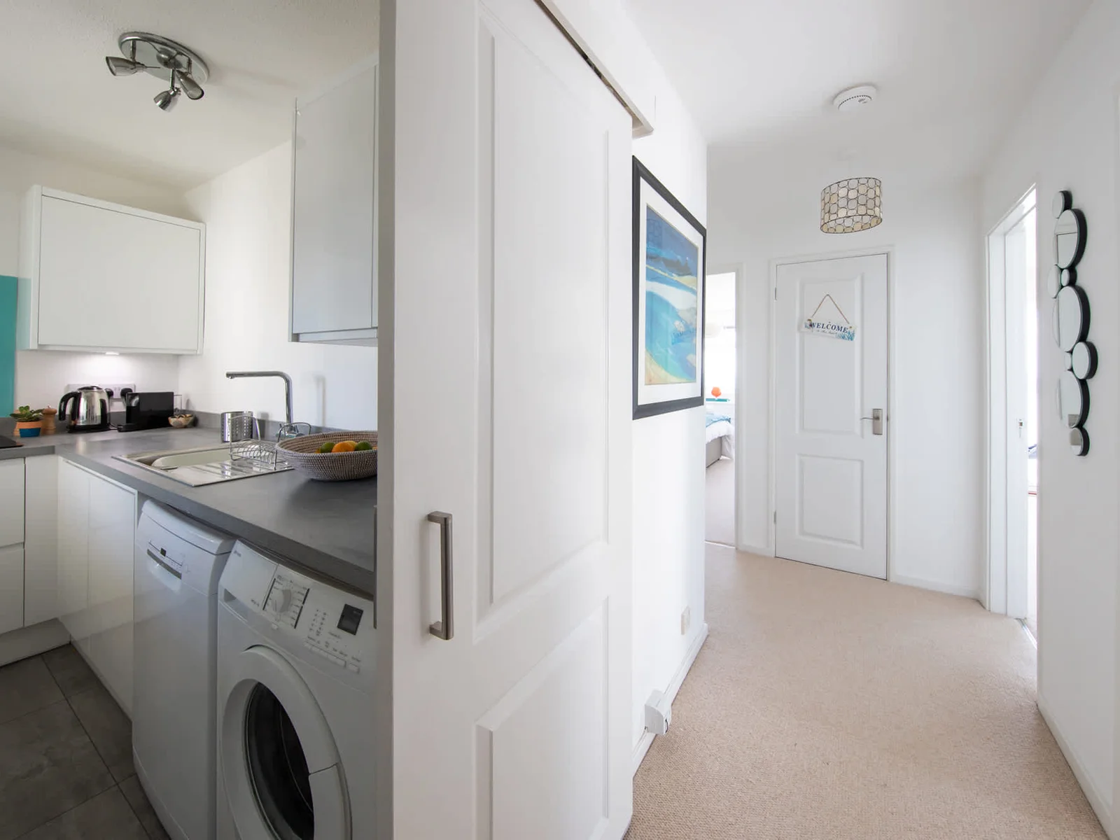 Spacious hallway connects all rooms of the apartment