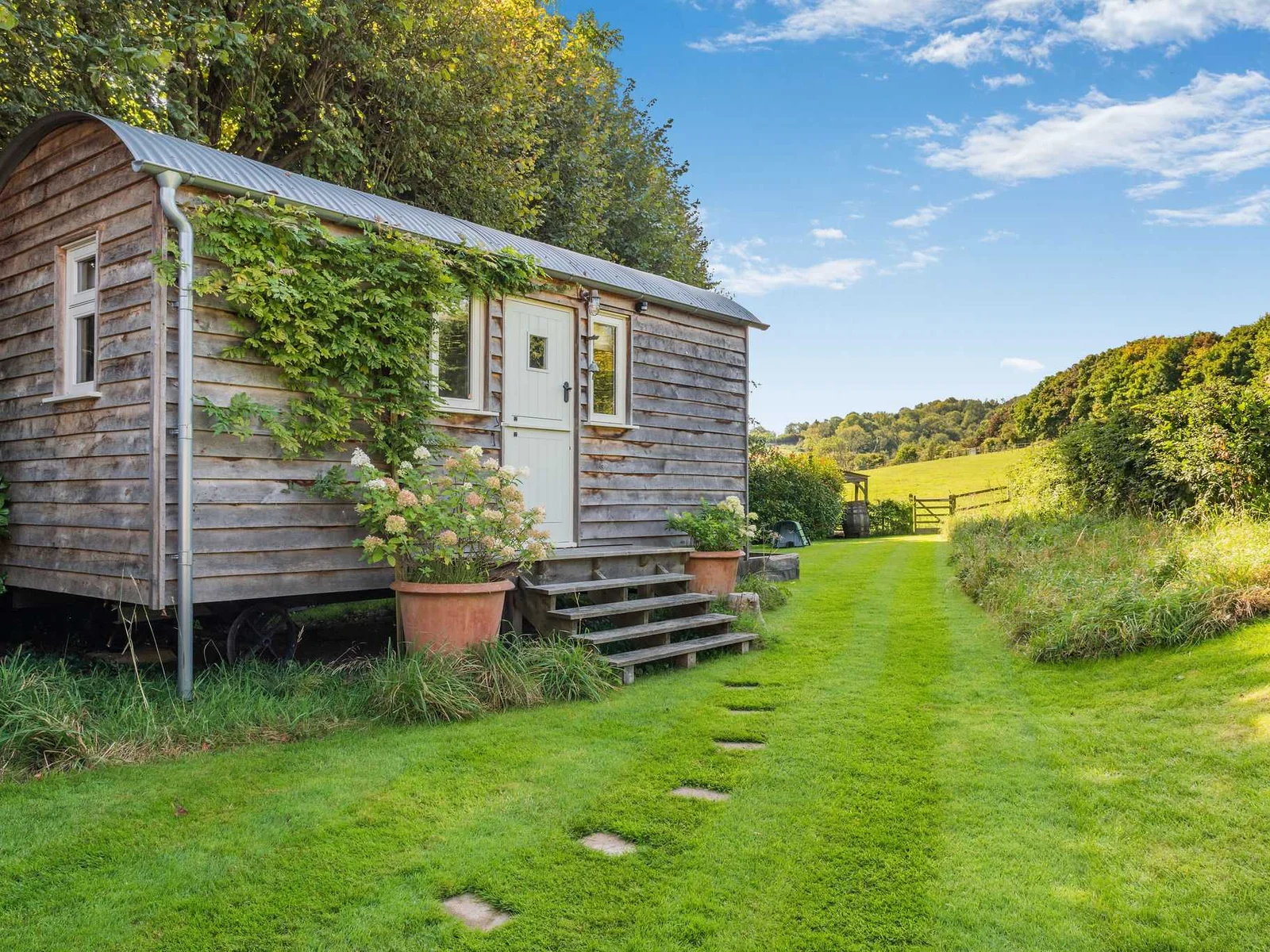 The bespoke Shepherd’s Hut, tucked away with beautiful countryside views.