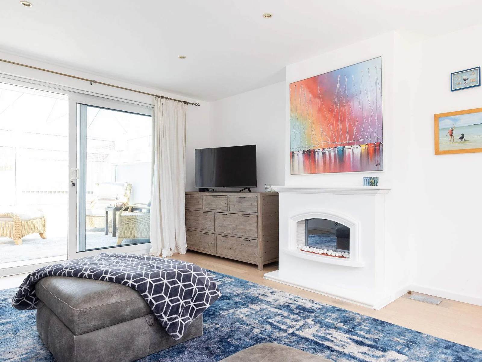 Bright lounge with smart TV and access to conservatory
