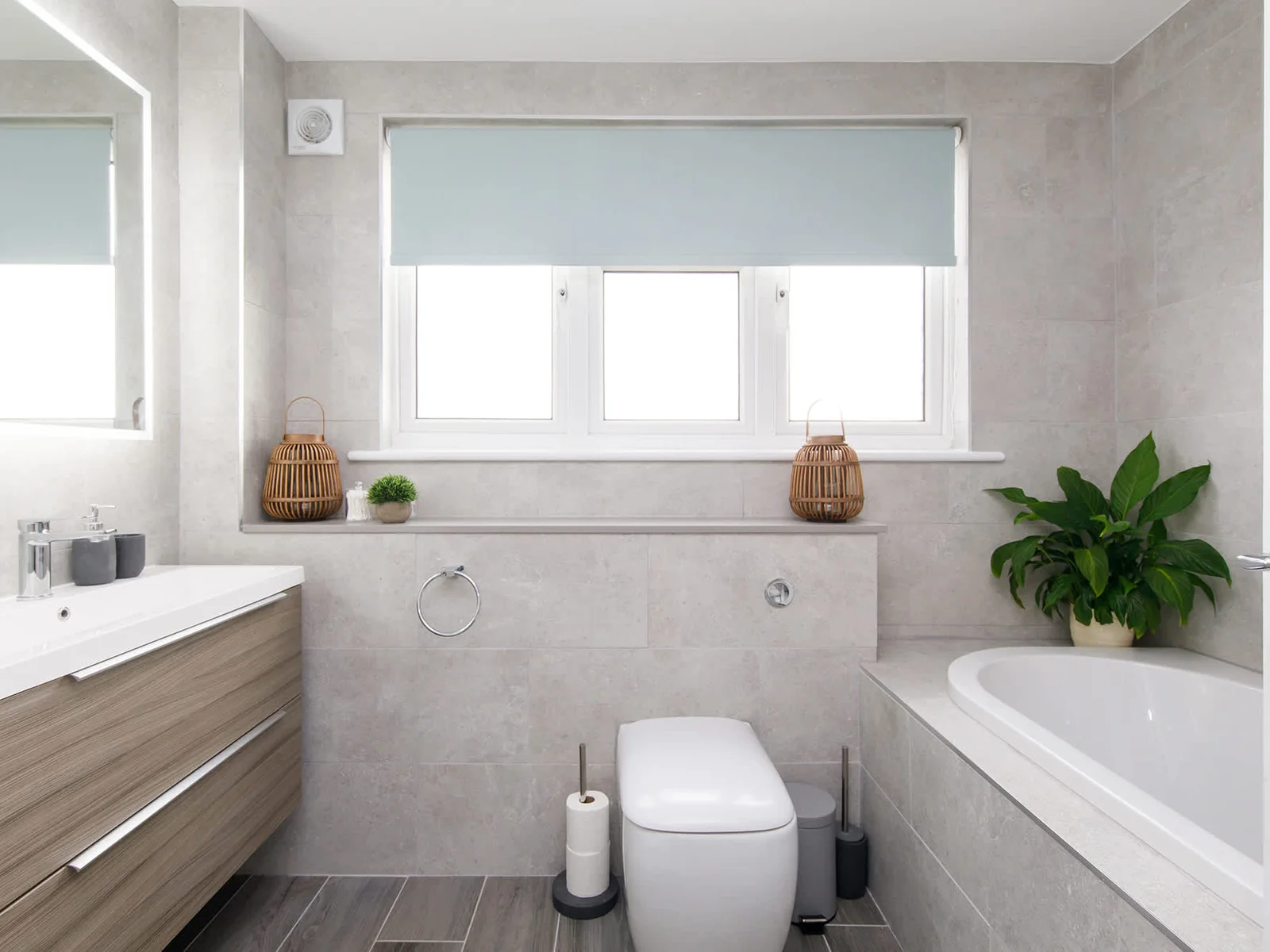 The modern family bathroom has a bath, separate shower, WC and sink.
