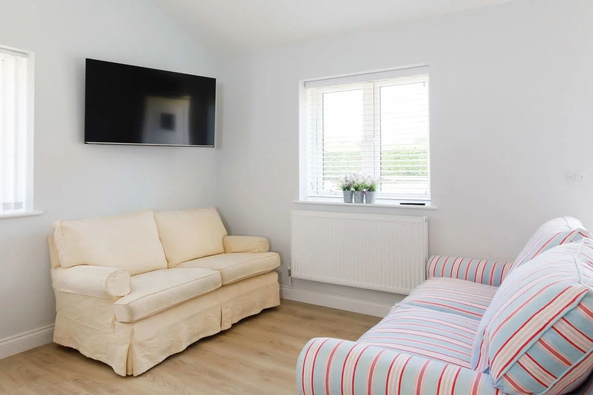There are two comfy sofas and a Smart TV to catch up on your favourite shows.