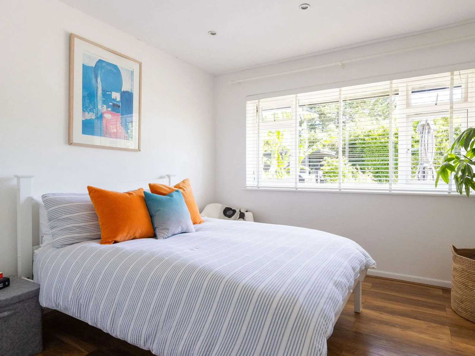 A fresh double bedroom with cheerful coastal touches
