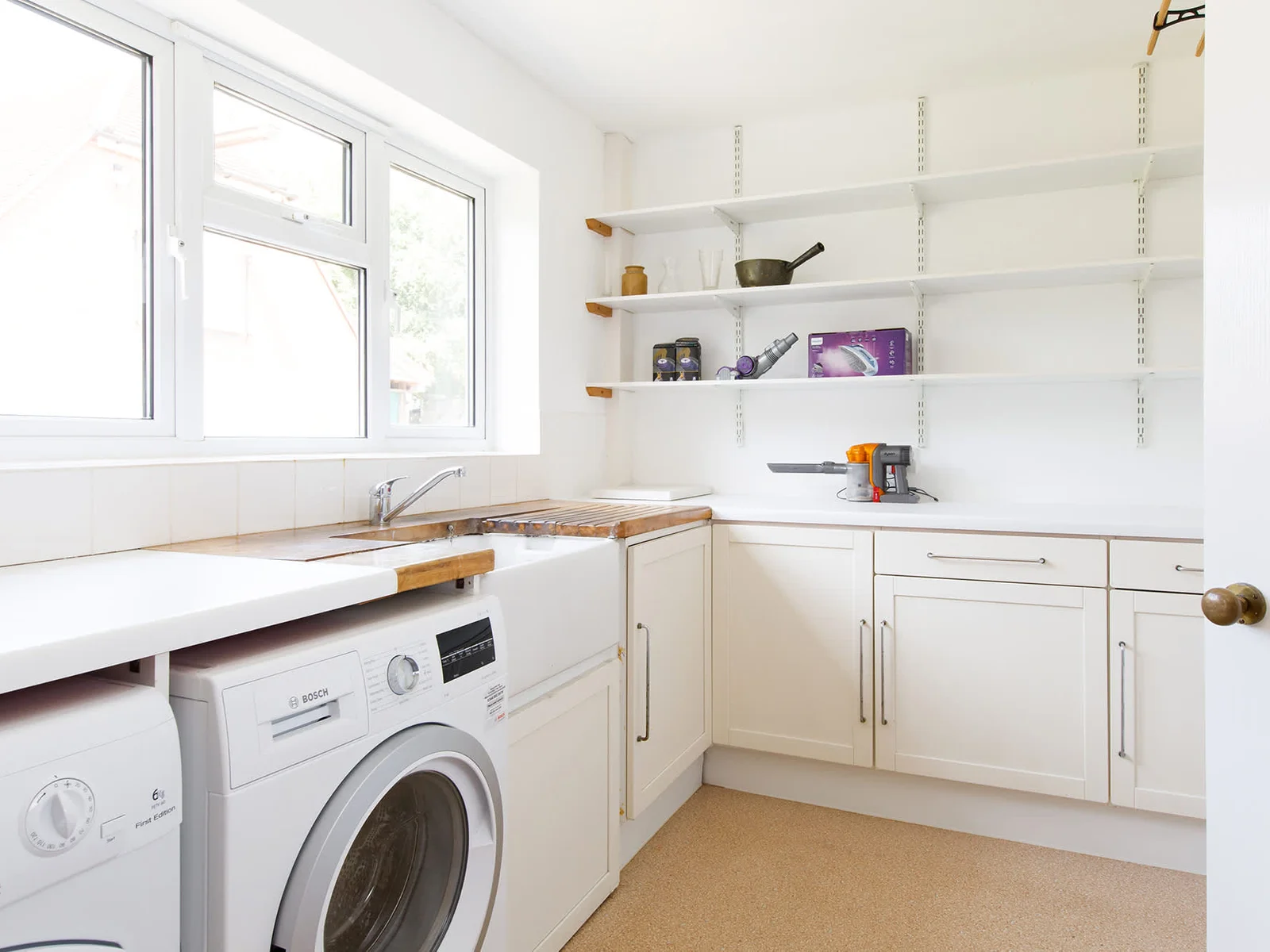 The large utility has a washer, dryer and plenty of room for sorting clothes and beach bags.
