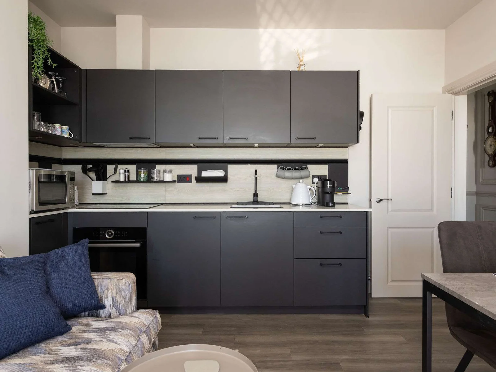 Modern interiors and a well-equipped kitchen make this seafront apartment ideal for an easy coastal stay.