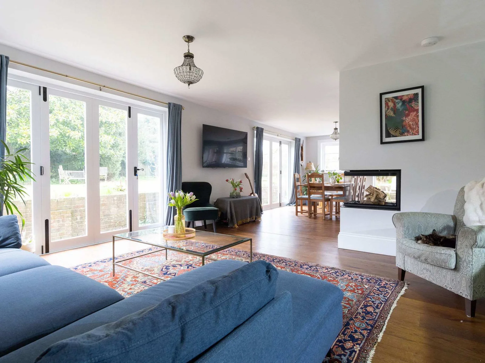 A bright and spacious open-plan living area with stunning garden views