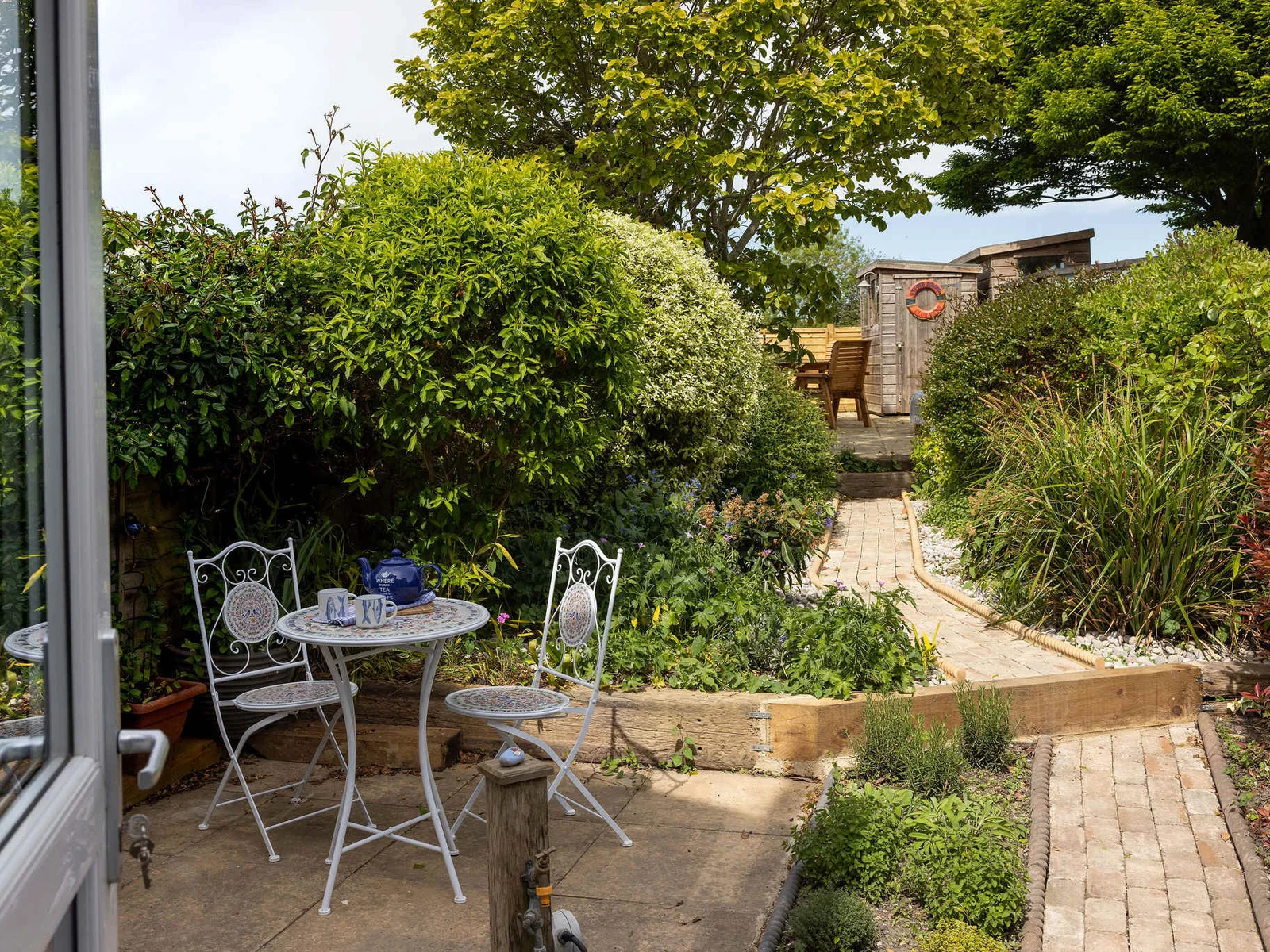 To the rear of the cottage, you’ll find a pretty, enclosed garden.