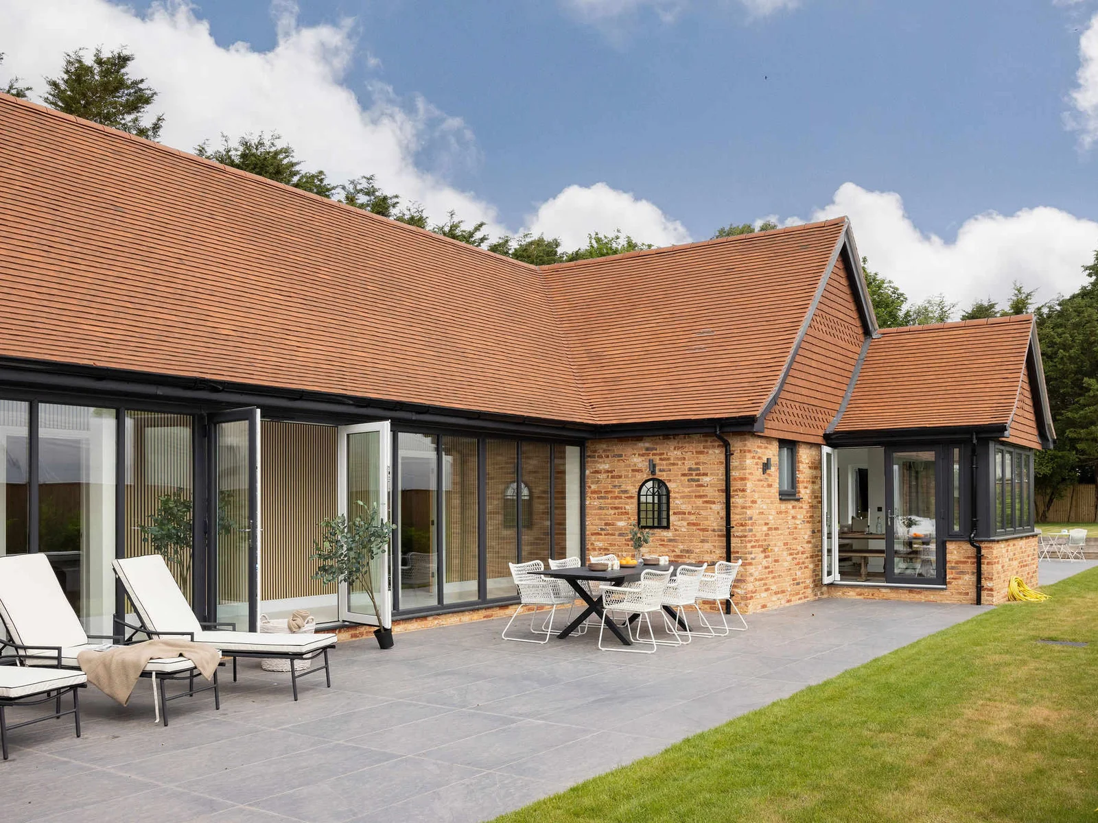 Spacious garden patio with outdoor dining and seating