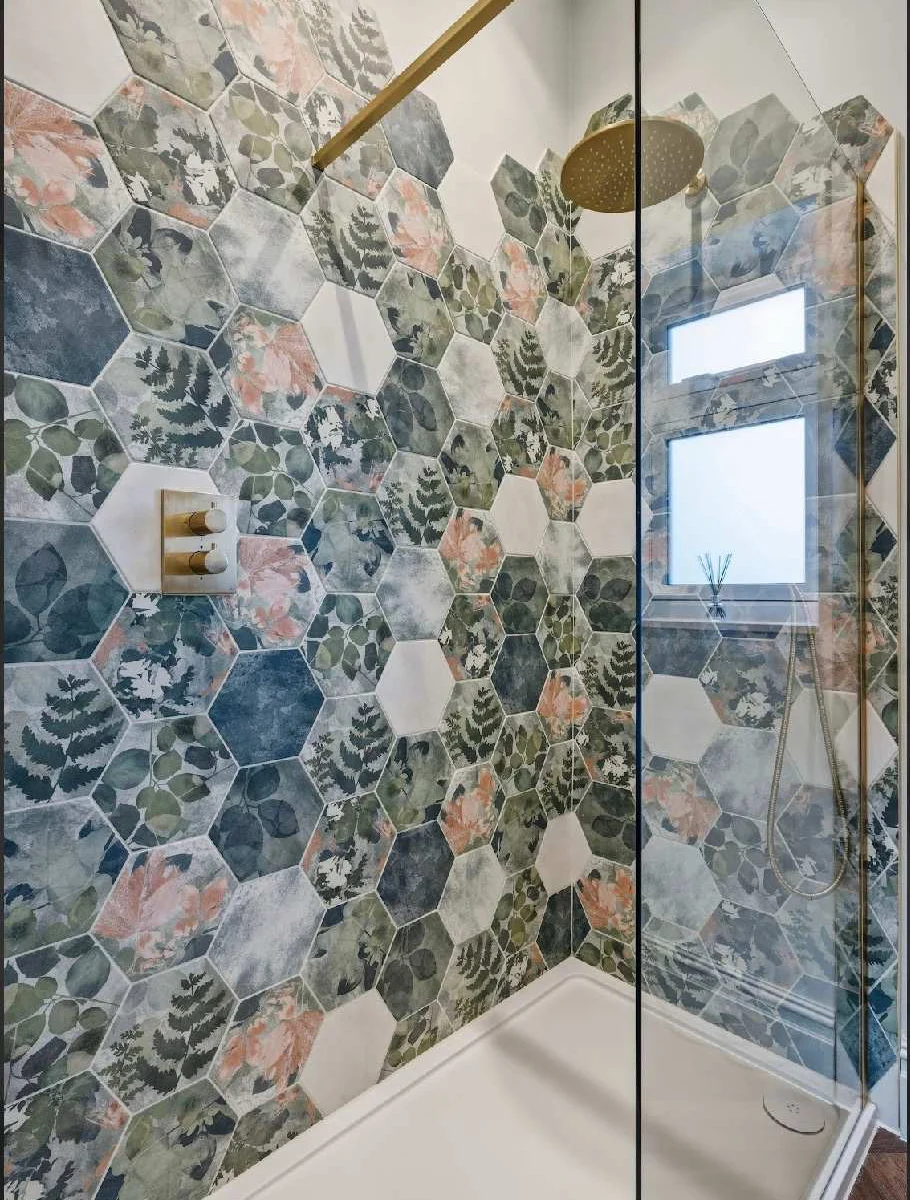 Spacious walk in shower with rainfall shower.