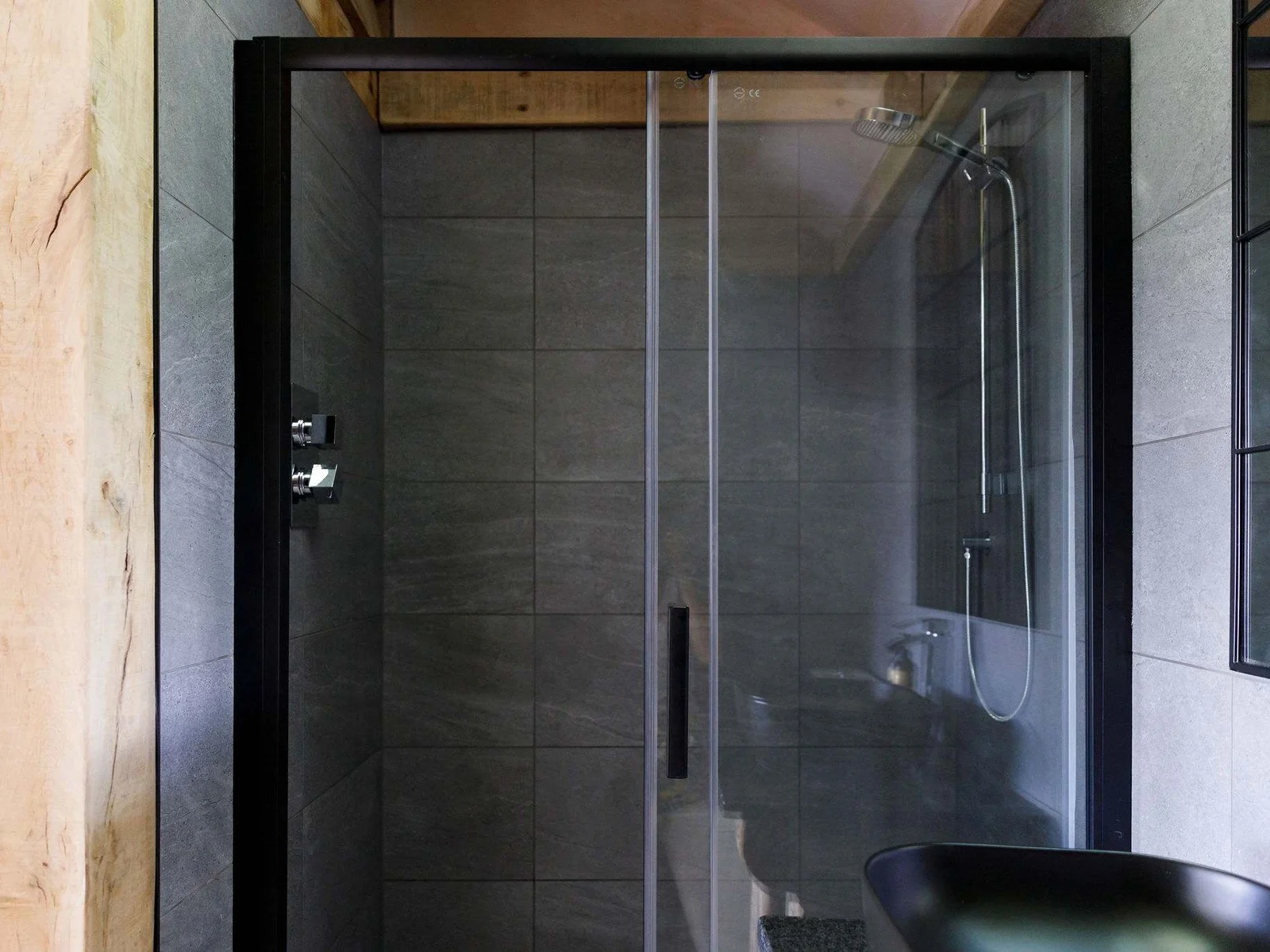 The surprisingly spacious ensuite bathroom features a huge walk-in shower.