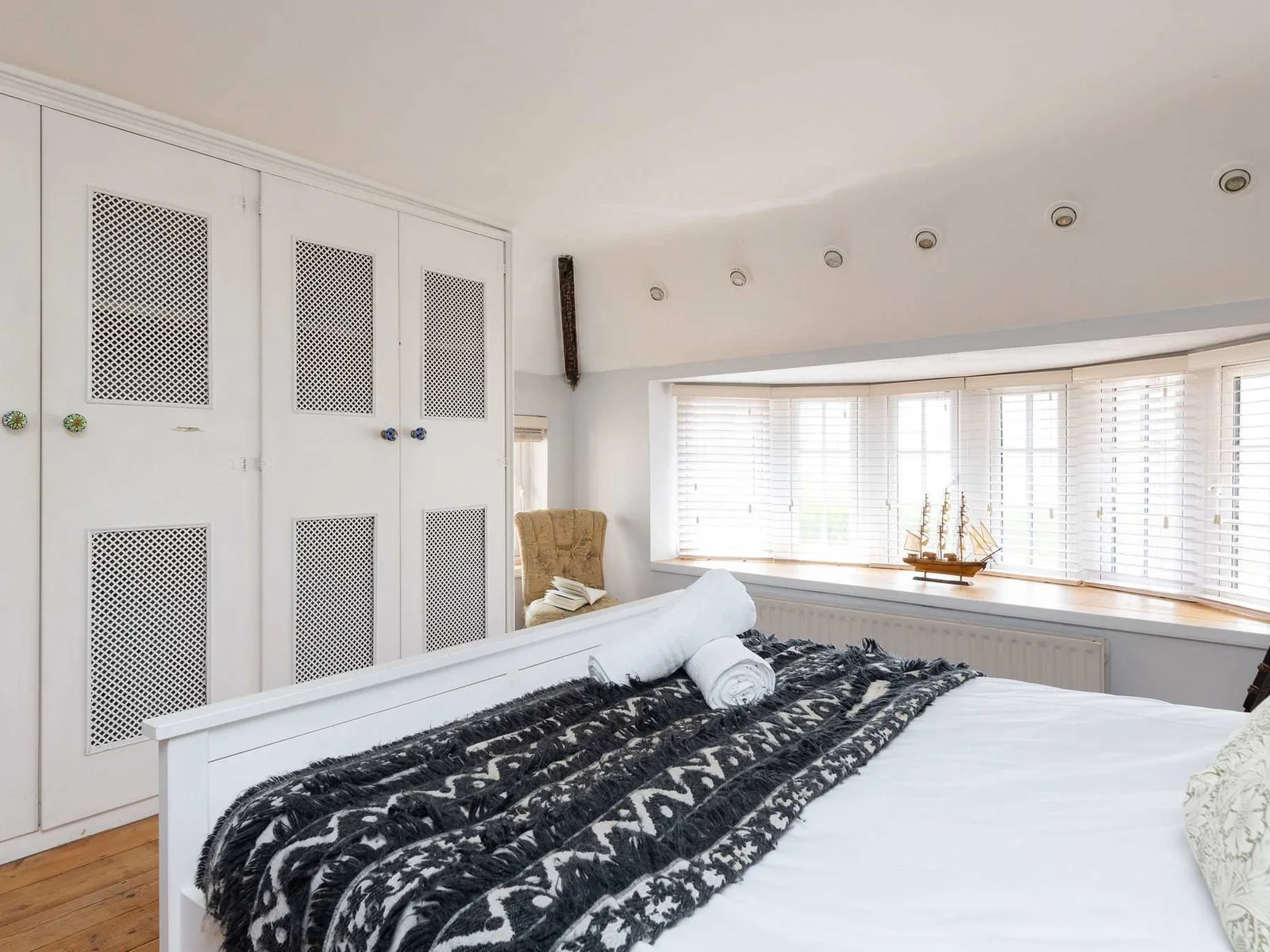 With ample wardrobe space and large bay windows.