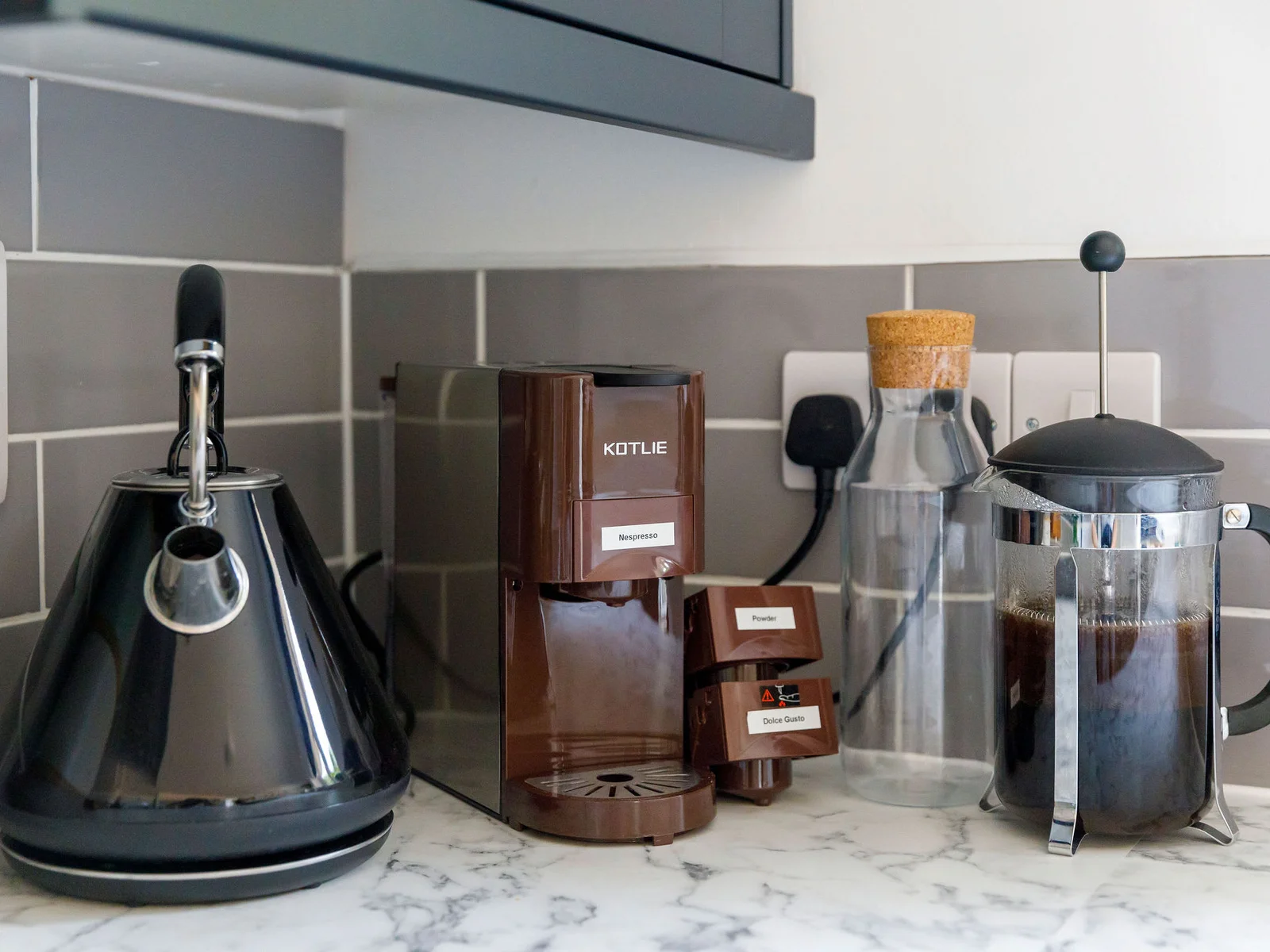 Start your day right with our well-equipped coffee station featuring a French press and coffee machine