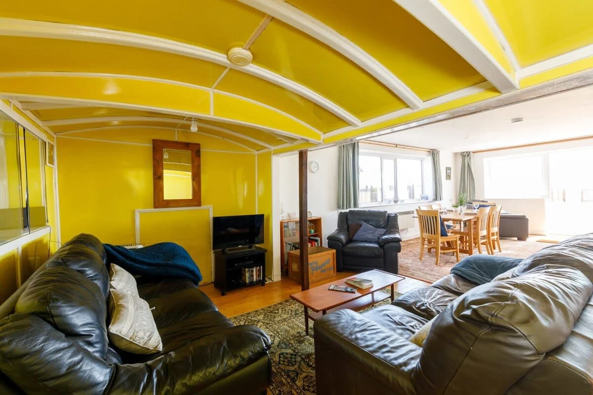With two large sofas and three comfy armchairs, there are plenty of places to relax.