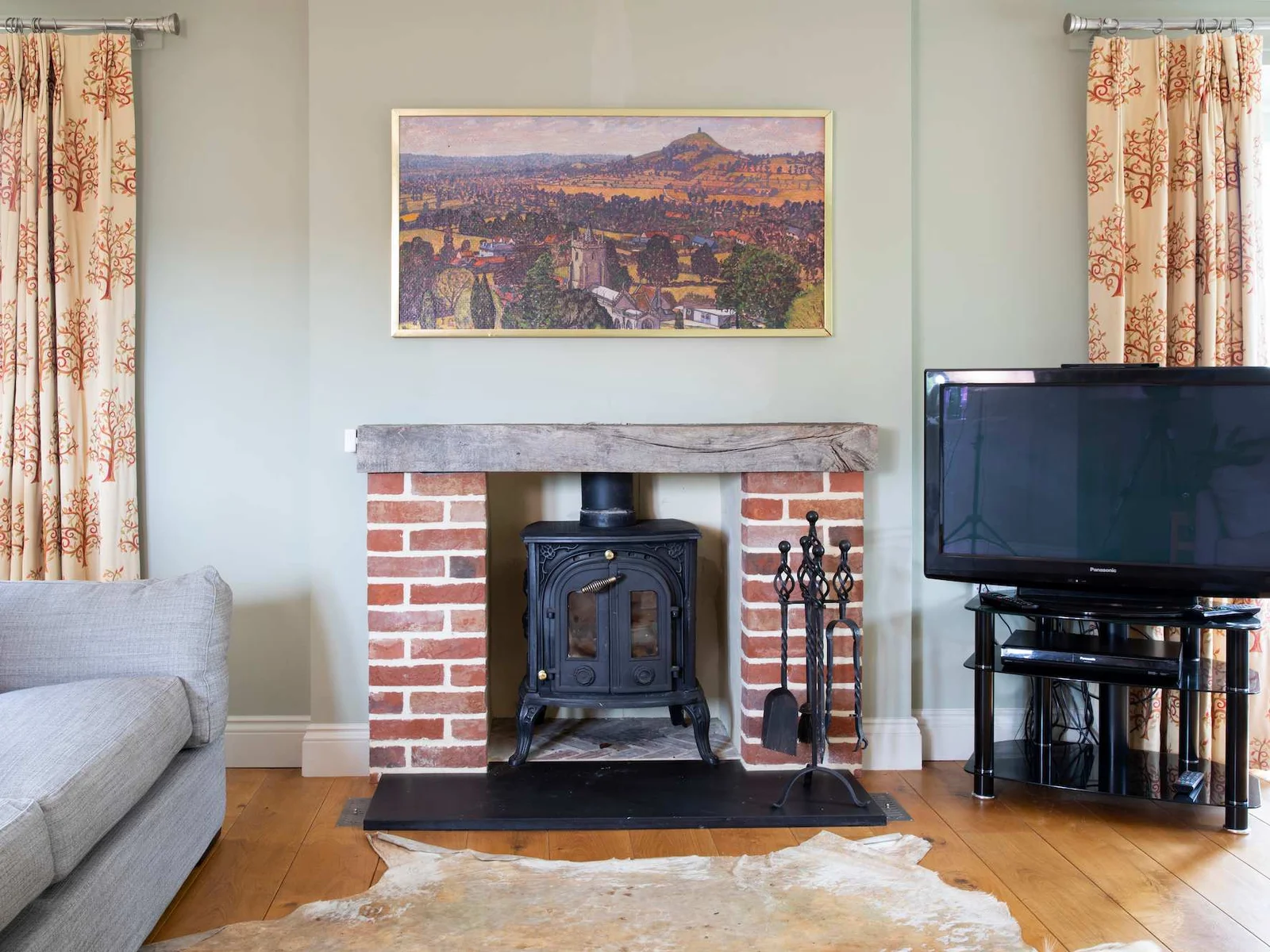 The main lounge is a superb space with wood burner and large lcd television