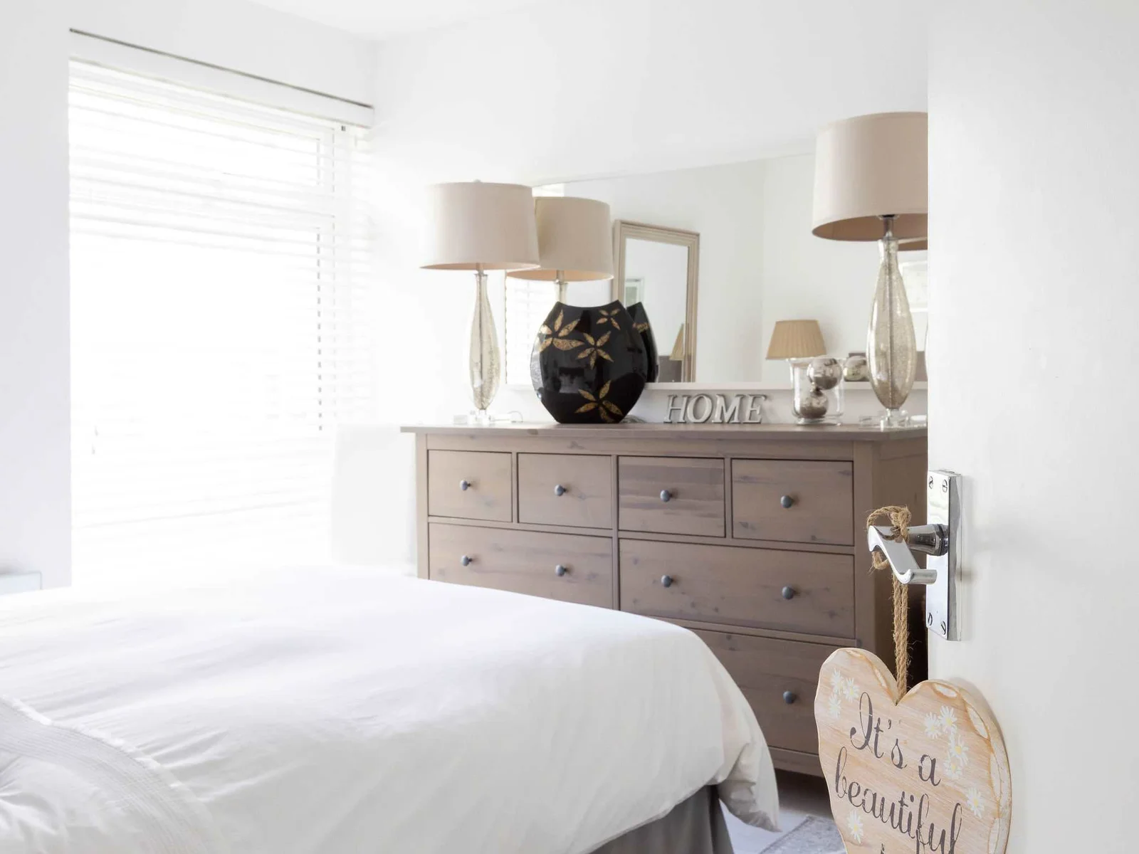 It's a beautiful day.....to stay in this warm and welcoming bedroom!