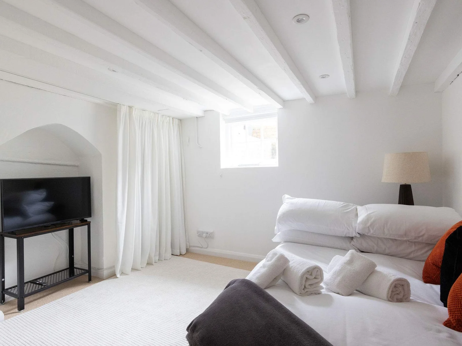 Head downstairs to the basement snug – a flexible second lounge or third sleeping space.