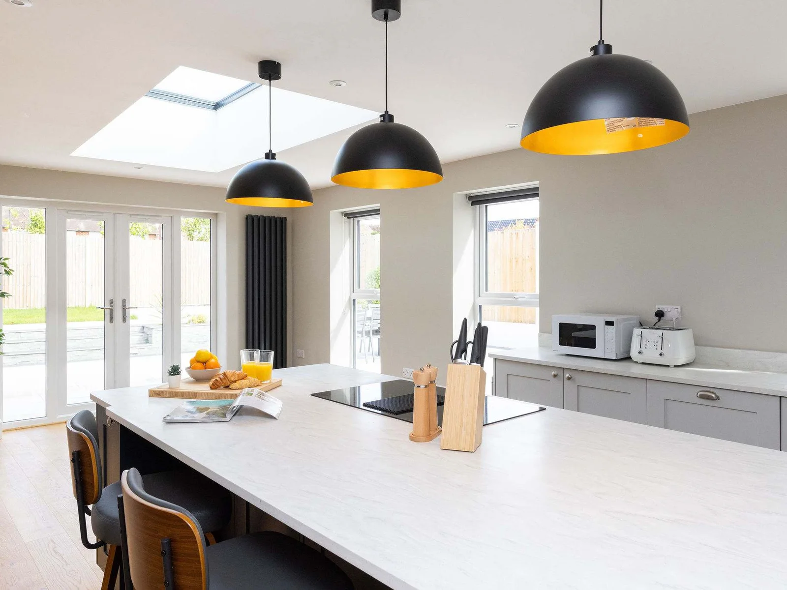 Enjoy garden views from this bright and modern kitchen space.