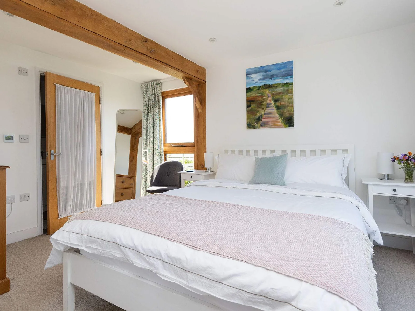 This cosy king bed awaits to offer you a peaceful and comfortable night's sleep.